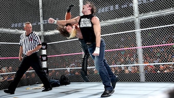 Dean Ambrose hits Seth Rollins with a clothesline.