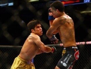 December 13, 2014; Phoenix, AZ, USA; Henry Cejudo punches Dustin Kimura during UFC Fight Night at US Airways Center. Mandatory Credit: Mark J. Rebilas-USA TODAY Sports