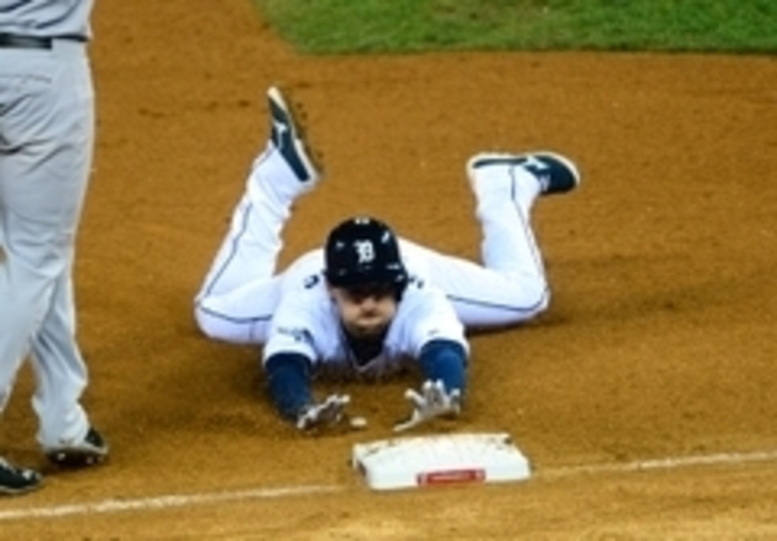 Oct 17, 2013; Detroit, MI, USA; Detroit Tigers shortstop Jose Iglesias (1) slides into third base against the Boston Red Sox during the seventh inning in game five of the American League Championship Series baseball game at Comerica Park. Mandatory Credit