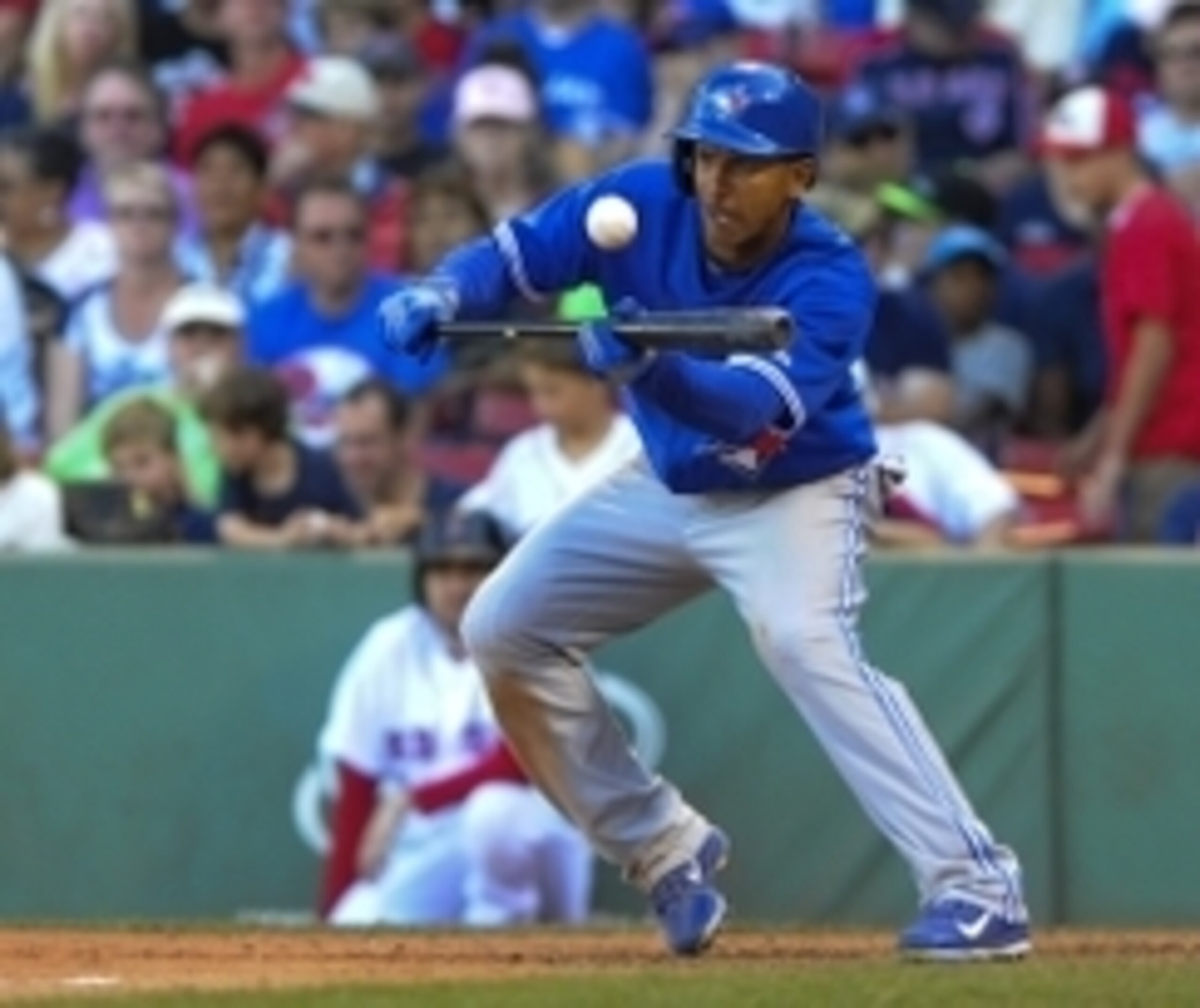 Sep 7, 2014; Boston, MA, USA; Toronto Blue Jays center fielder Anthony Gose (8) bunts during the ninth inning against the Boston Red Sox at Fenway Park. Mandatory Credit: Bob DeChiara-USA TODAY Sports