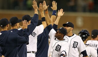 DETROIT, MI - SEPTEMBER 25: Rajai Davis #20 of the Detroit Tigers celebrates a win over the Minnesota Twins with his teammates at Comerica Park on September 25, 2014 in Detroit, Michigan. The Tigers defeated the Twins 4-2.  (Photo by Leon Halip/Getty Imag