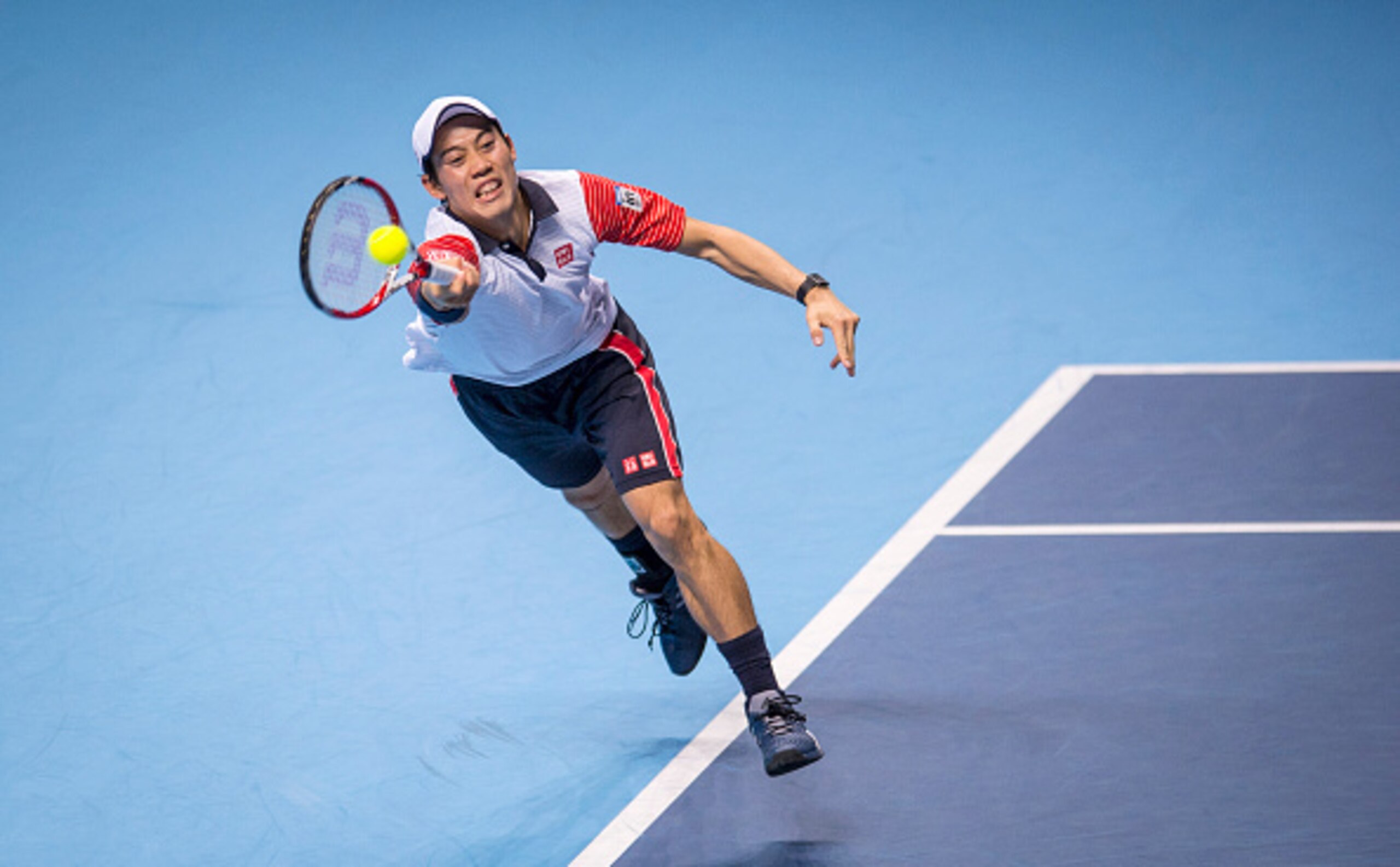 LONDON, ENGLAND - NOVEMBER 15:  Kei Nishikori of Japan in action during the round robin singles match against  Novak Djokovic of Serbia on day seven of the Barclays ATP World Tour Finals at O2 Arena on November 15, 2014 in London, England.  (Photo by Just