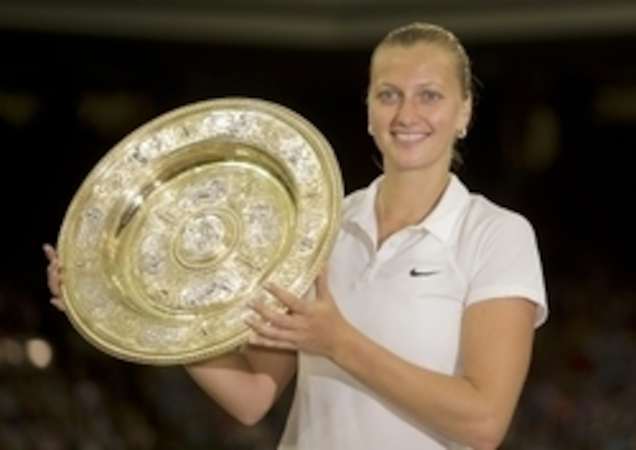 Petra Kvitova poses with the Wimbledon trophy.