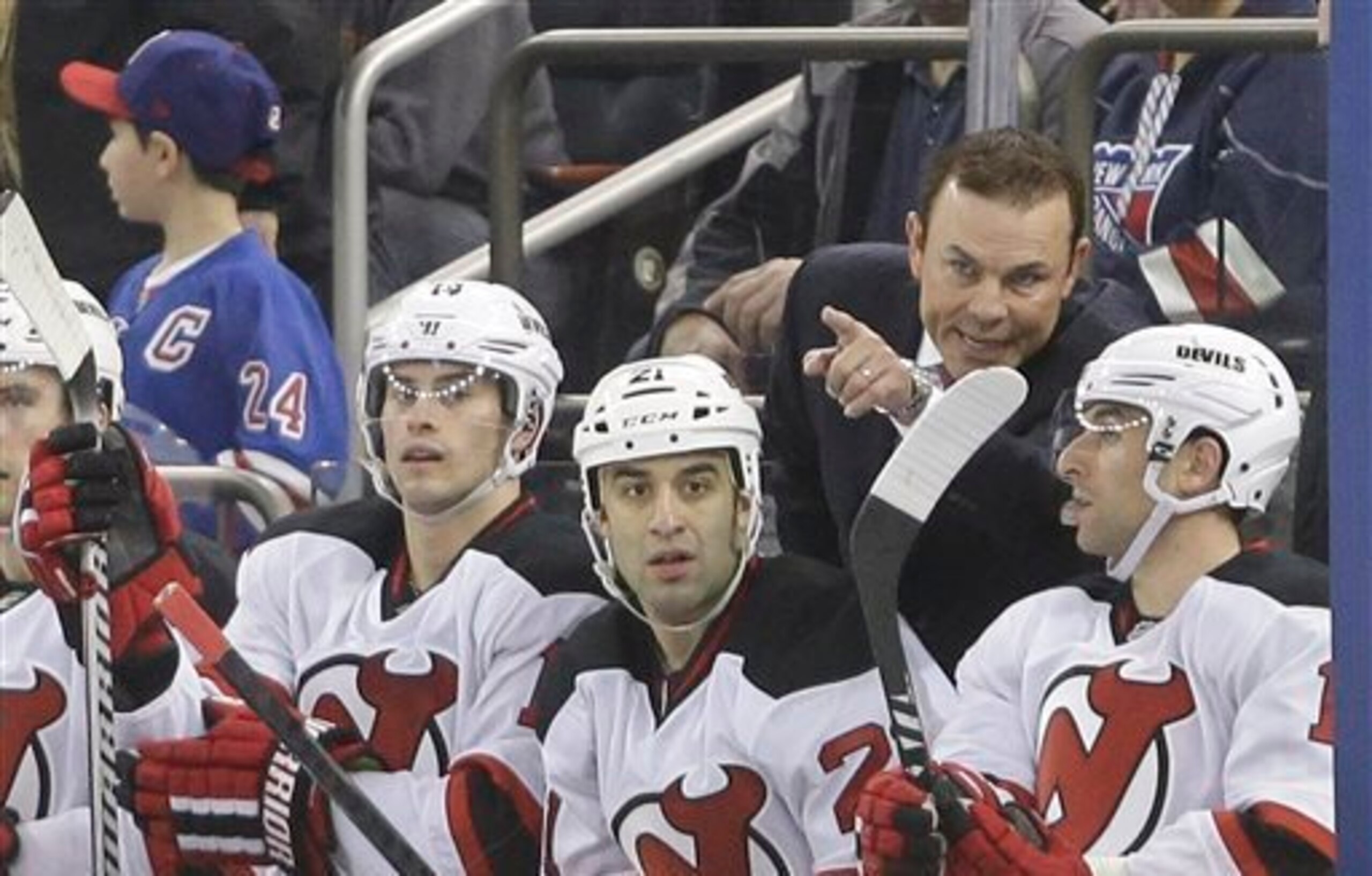 Adam Oates gives instructions to Stephen Gionta.