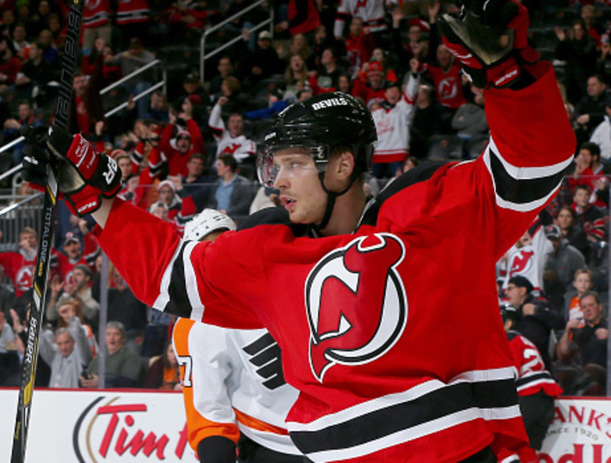 Adam Larsson celebrates a Devils goal.