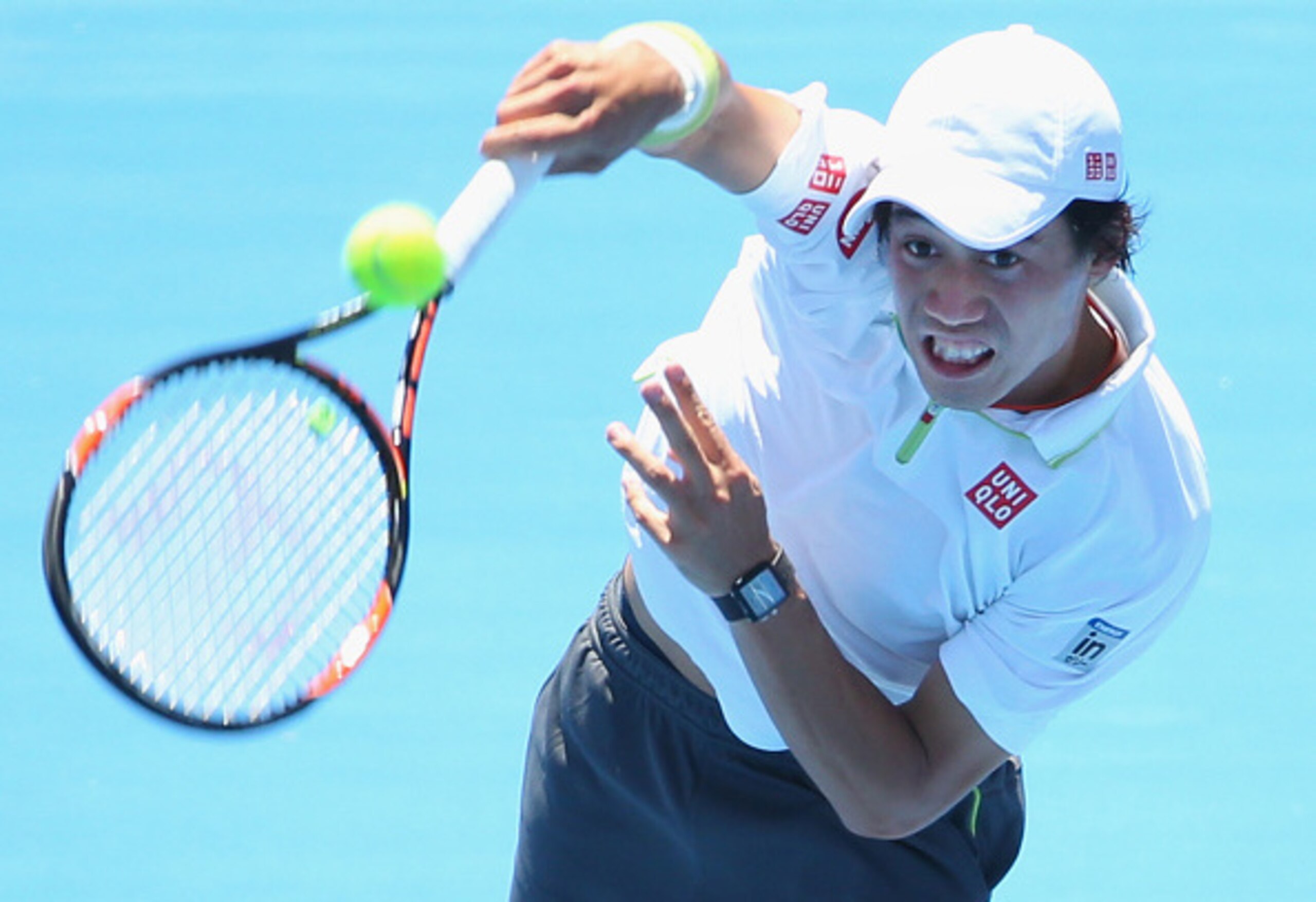Kei Nishikori serves during a match in the 2015 Priceline Pharmacy Classic in Melbourne.