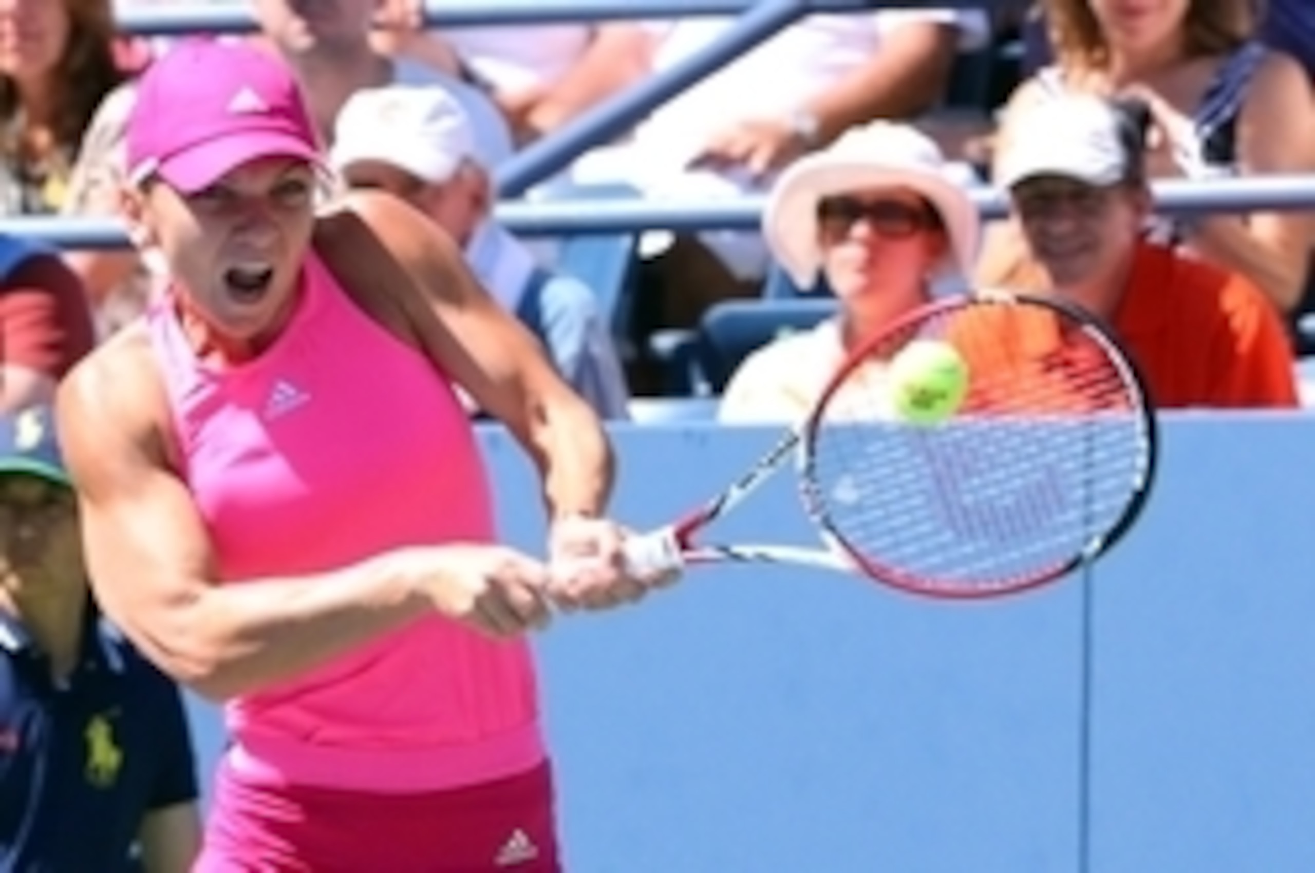 Simona Halep hits a backhand during 2014 U.S. Open.