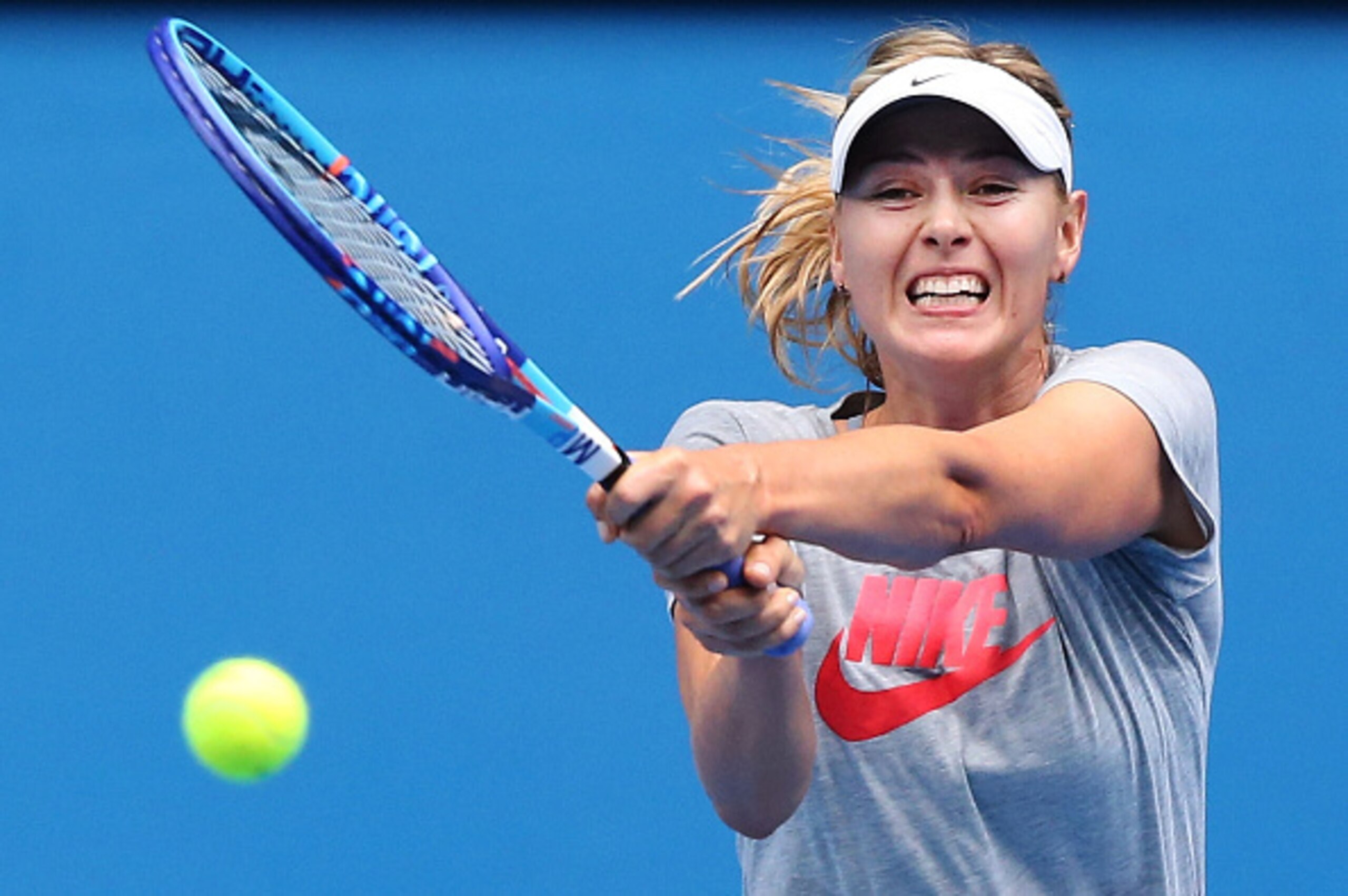 Maria Sharapova hits a backhand during a practice session before the 2015 Australian Open.