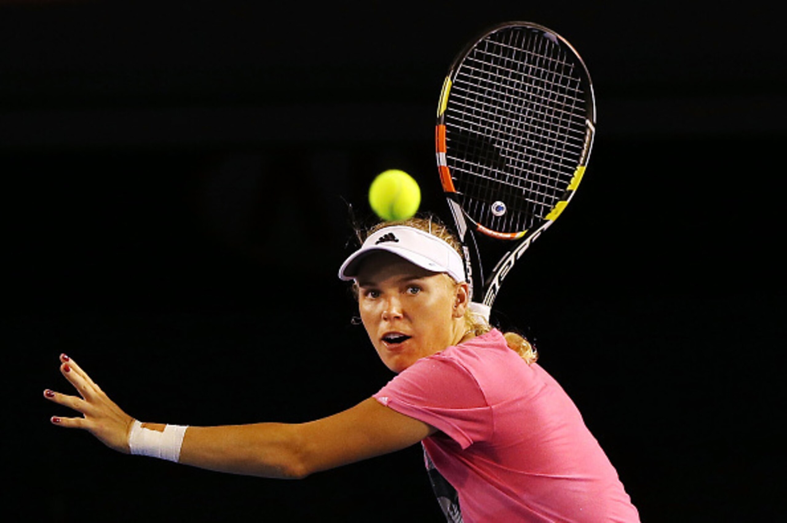 Caroline Wozniacki is focused on the ball during a practice session ahead of the 2015 Australian Open.