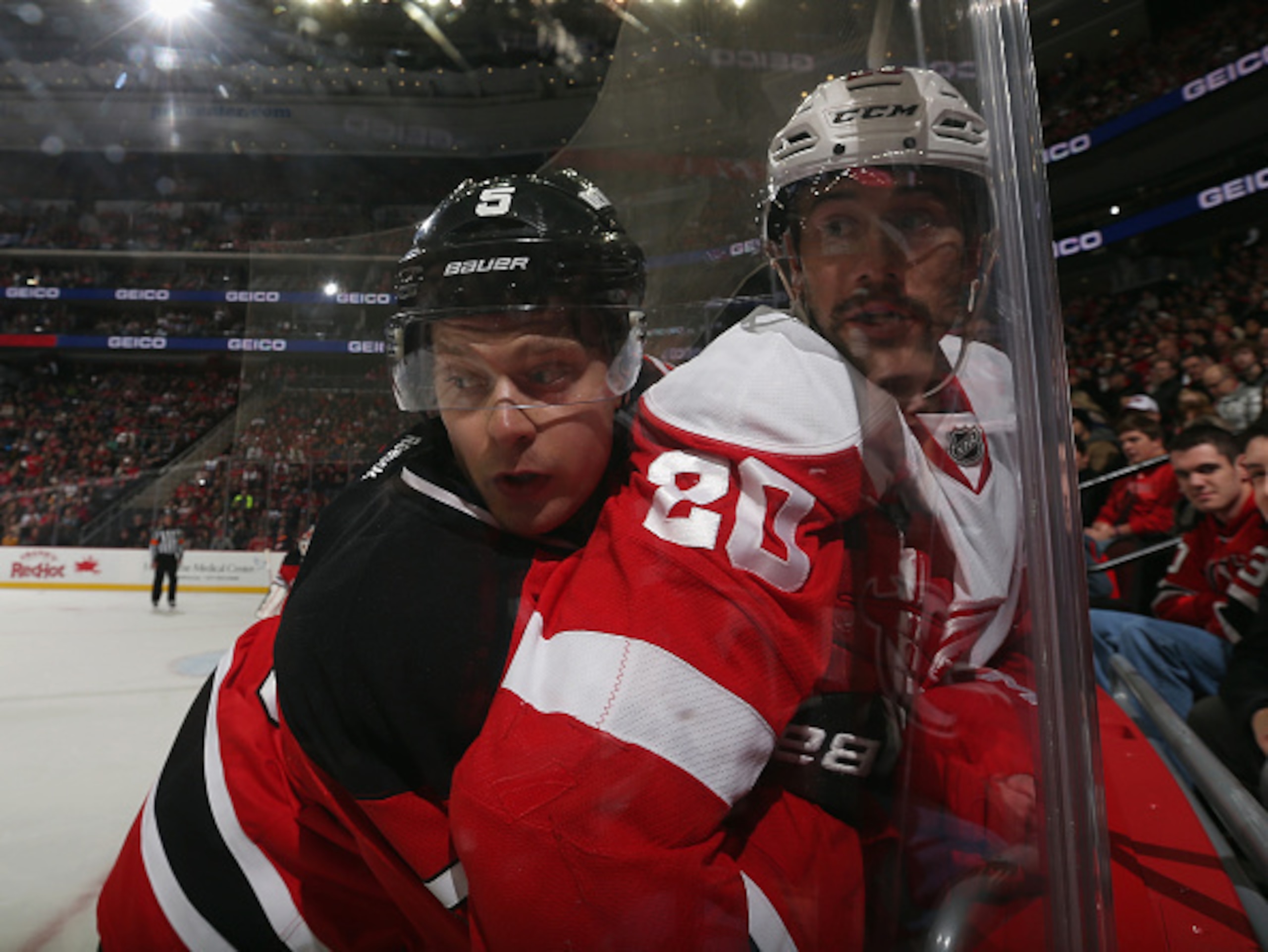 Adam Larsson makes a physical play along the boards against the Detroit Red Wings.