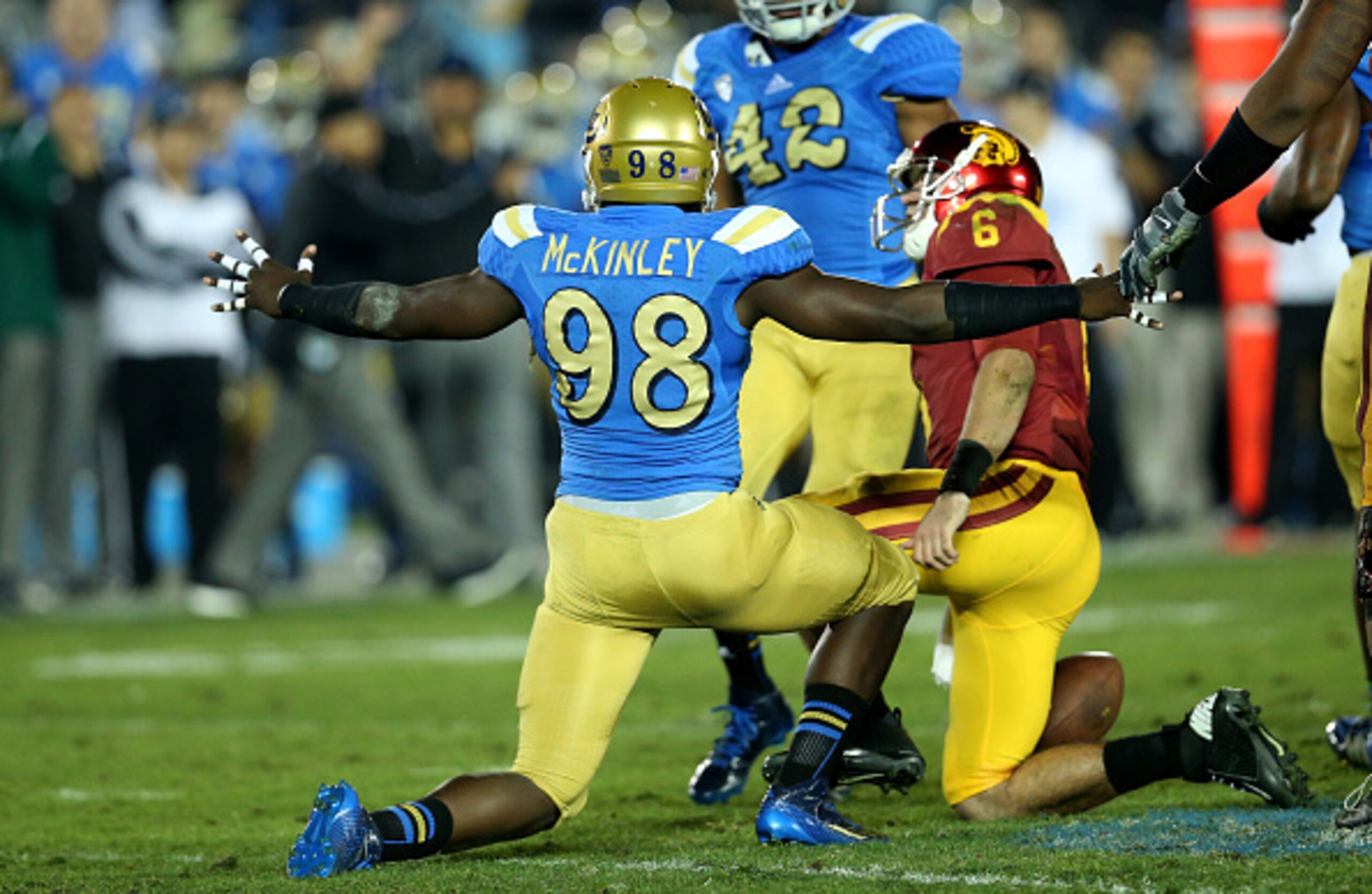 McKinley making a sack versus Southern Cal.