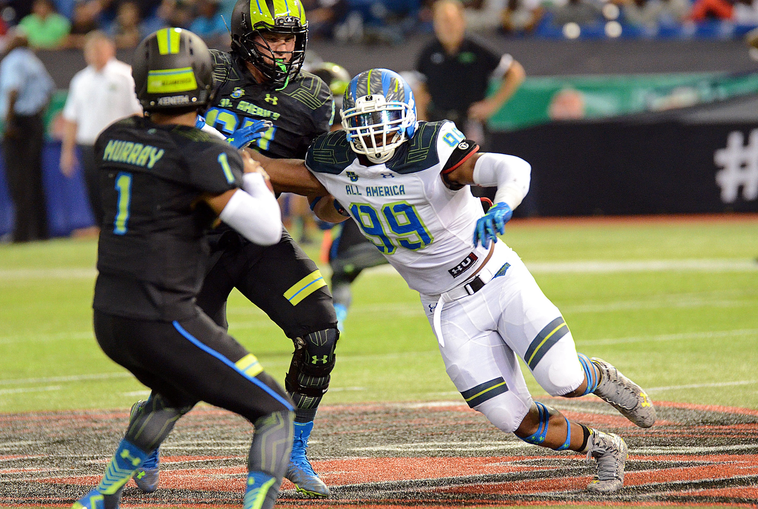 5-star defensive end prospect Byron Cowart (right) heads toward Texas A&M quarterback commit Kyler Murray during the Jan. 2 Under Armour All-America Game.