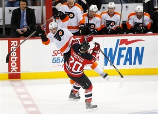 Jordin Tootoo collides with a Philadelphia Flyer.