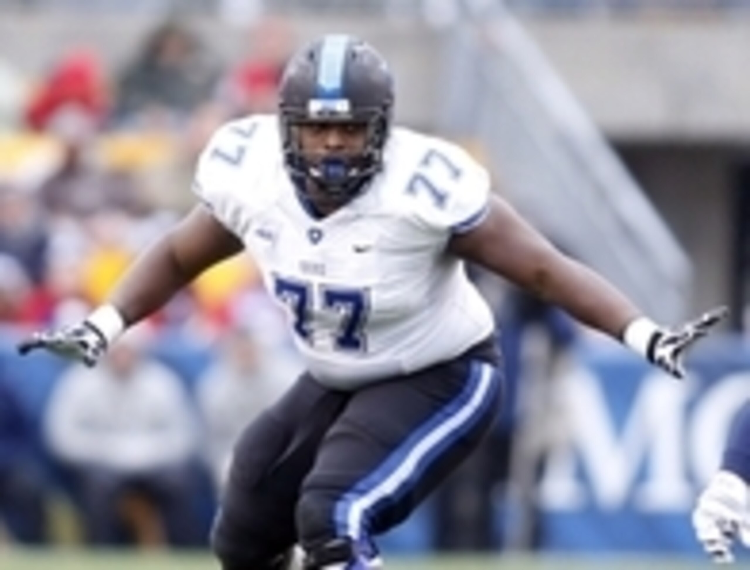 Nov 1, 2014; Pittsburgh, PA, USA; Duke Blue Devils guard Laken Tomlinson (77) blocks at the line of scrimmage against the Pittsburgh Panthers during the second quarter at Heinz Field. Mandatory Credit: Charles LeClaire-USA TODAY Sports