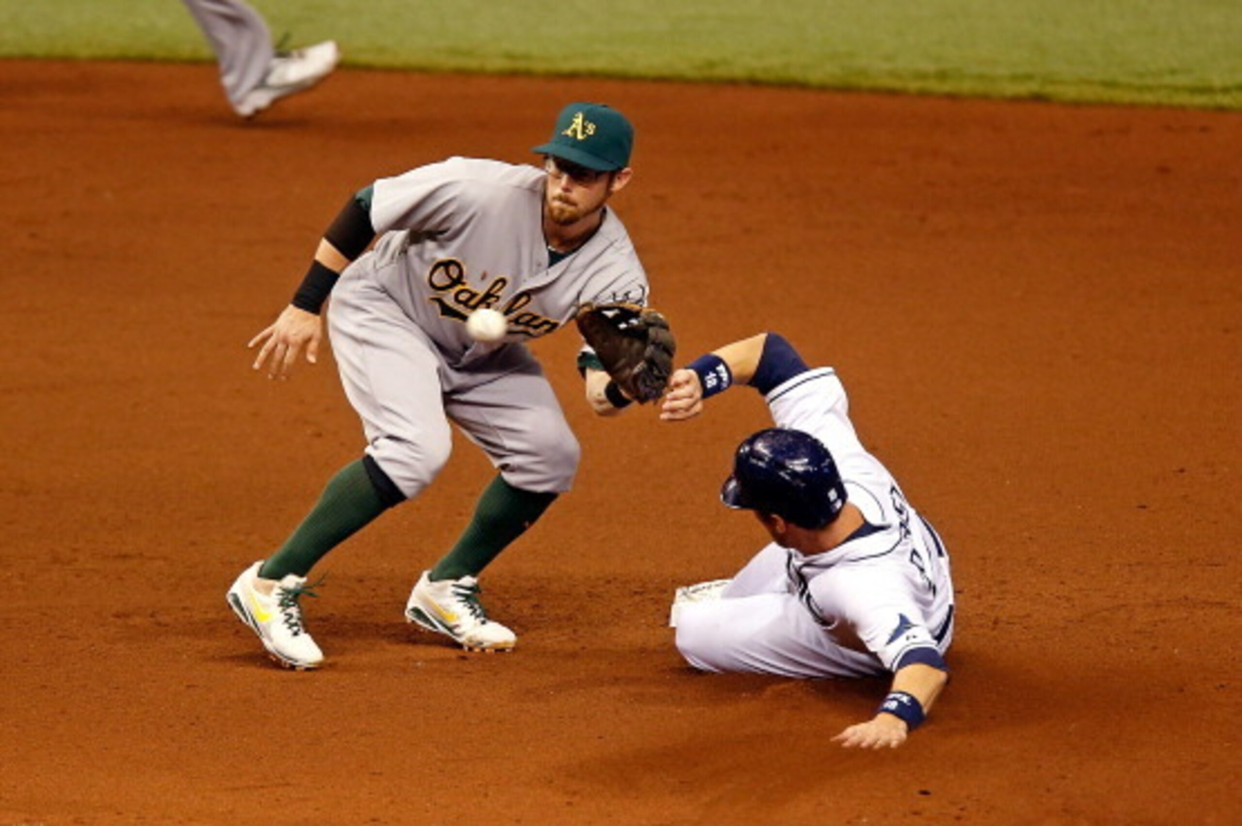 Ben Zobrist slides into second as Eric Sogard attempts a tag.
