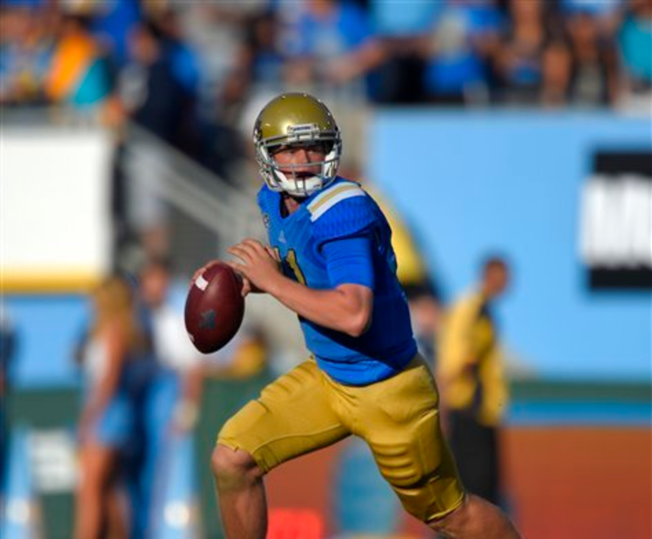 Neuheisel scrambling in the Stanford game.