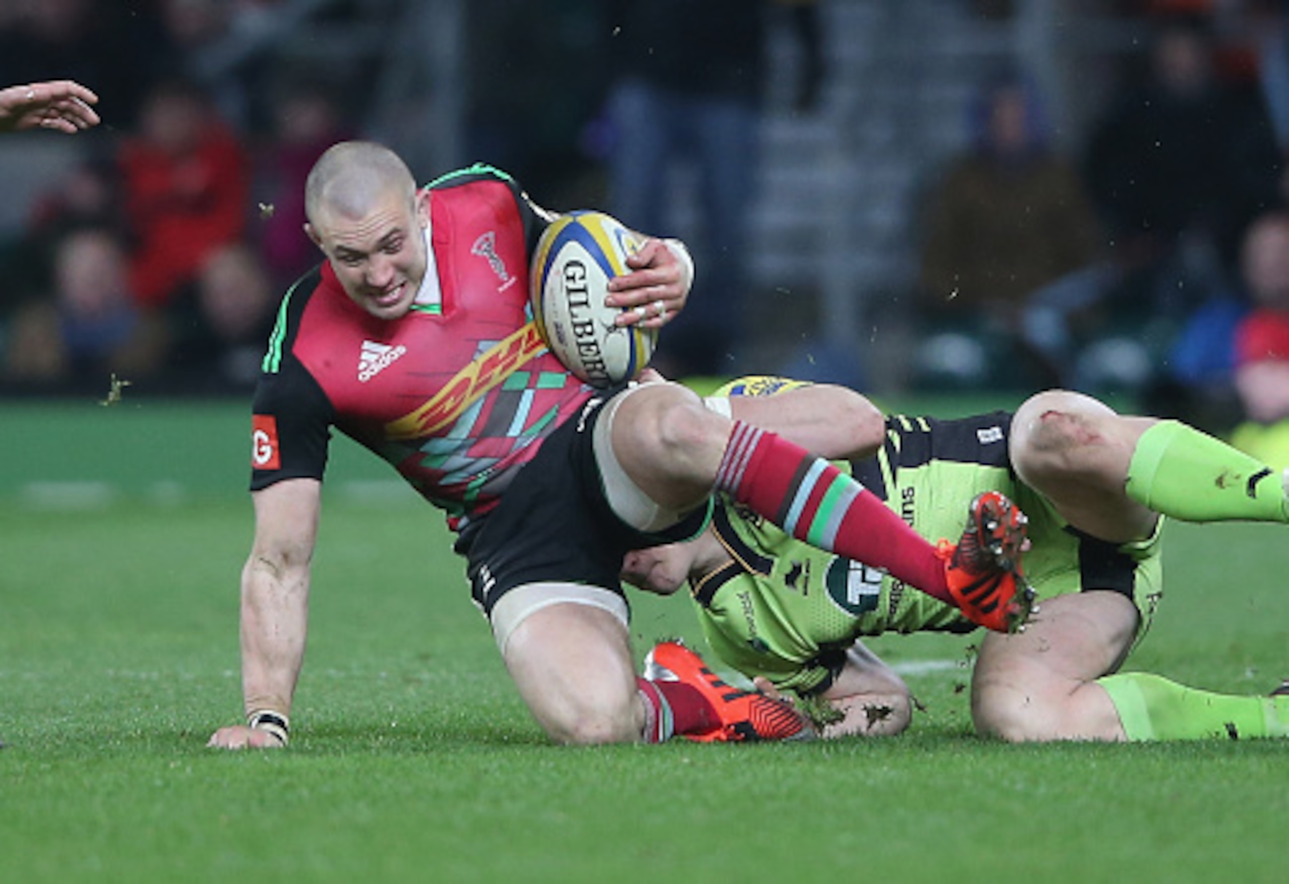 LONDON, ENGLAND - DECEMBER 27:  Mike Brown of Harlequins is tackled by Tom Stephenson during the Aviva Premiership match between Harlequins and Northampton Saints at Twickenham Stadium on December 27, 2014 in London, England.  (Photo by David Rogers/Getty