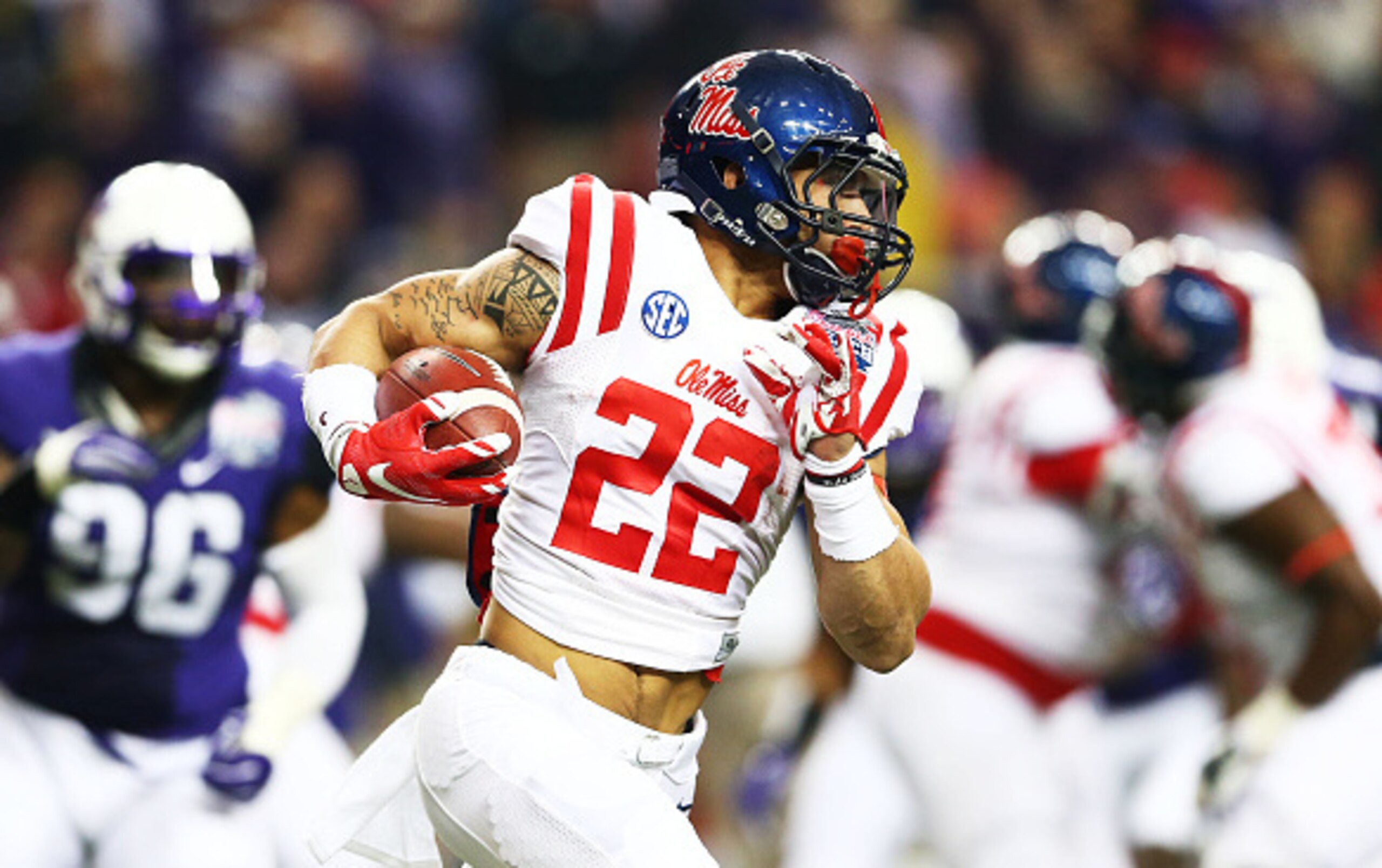 ATLANTA, GA - DECEMBER 31:  Jordan Wilkins #22 of the Ole Miss Rebels carries the ball against the TCU Horned Frogs during the Chik-fil-A Peach Bowl at Georgia Dome on December 31, 2014 in Atlanta, Georgia.  (Photo by Streeter Lecka/Getty Images)