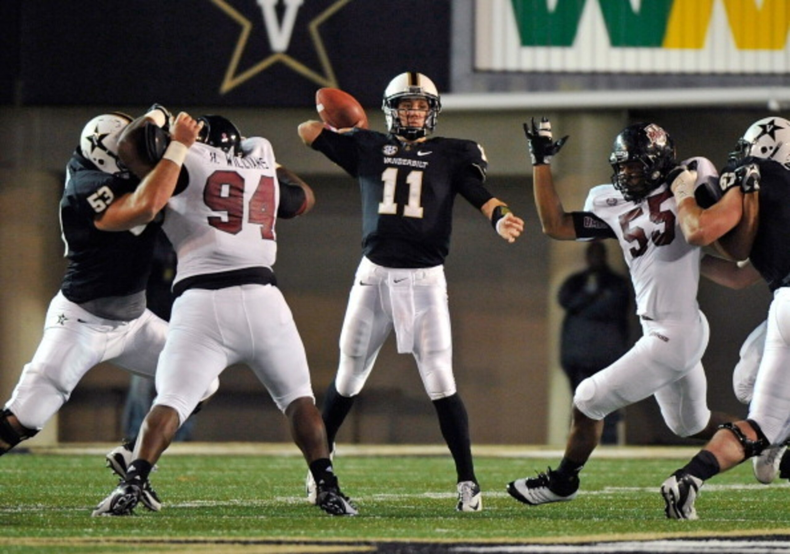 NASHVILLE, TN - OCTOBER 27:  Hafis Williams #94 and Ryan Delaire #55 of the University of Massachusetts Minutemen rush quarterback Jordan Rodgers #11 of the Vanderbilt Commodores at Vanderbilt Stadium on October 27, 2012 in Nashville, Tennessee.  (Photo b