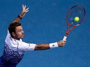 Wawrinka hits a backhand volley in his quarterfinal match at the 2015 Australian Open.