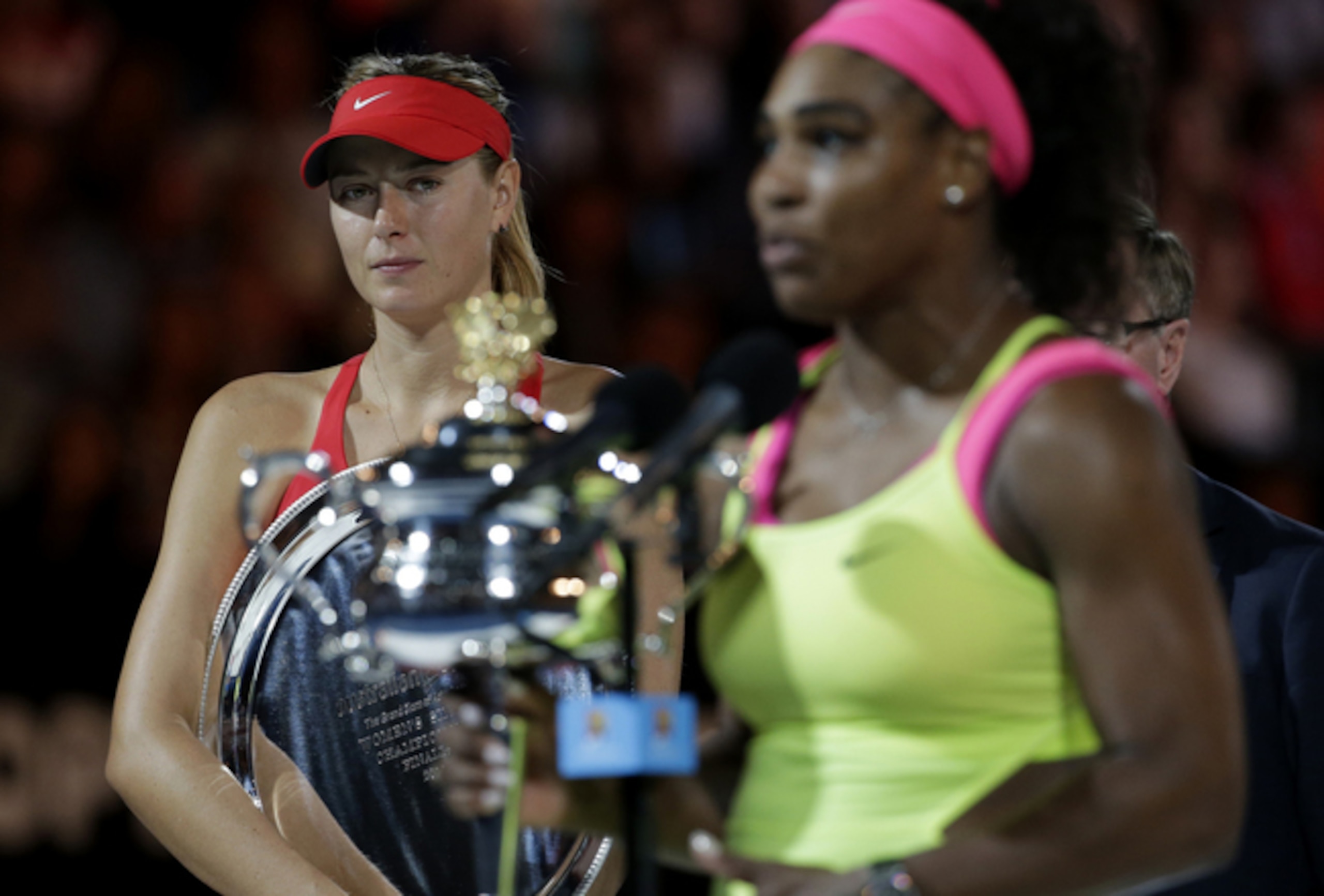 With the winner's trophy within sight, Maria Sharapova holds the runnerup plate after the finals of the 2015 Australian Open.