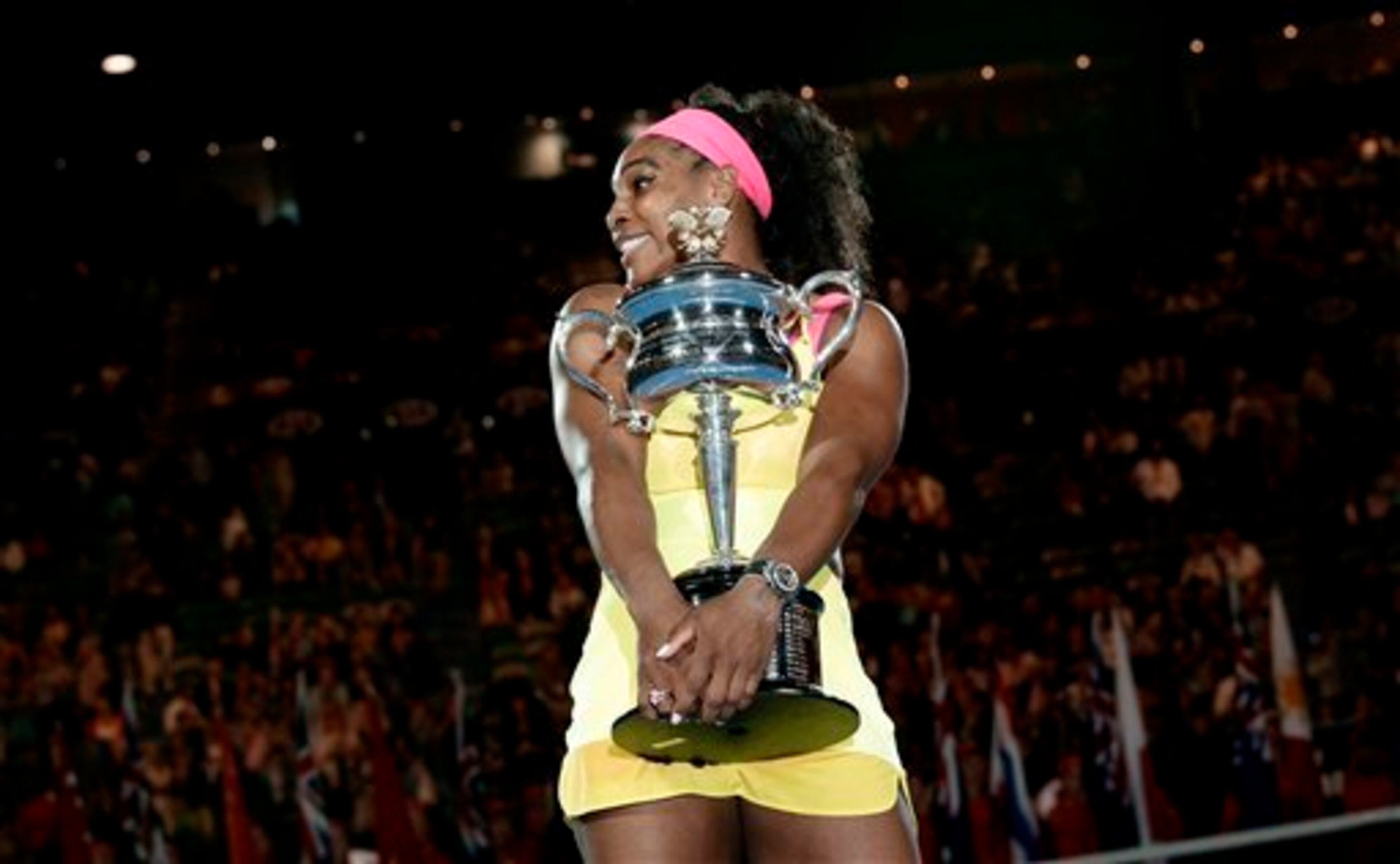 Serena Williams hugs her trophy after winning her sixth Australian Open title.