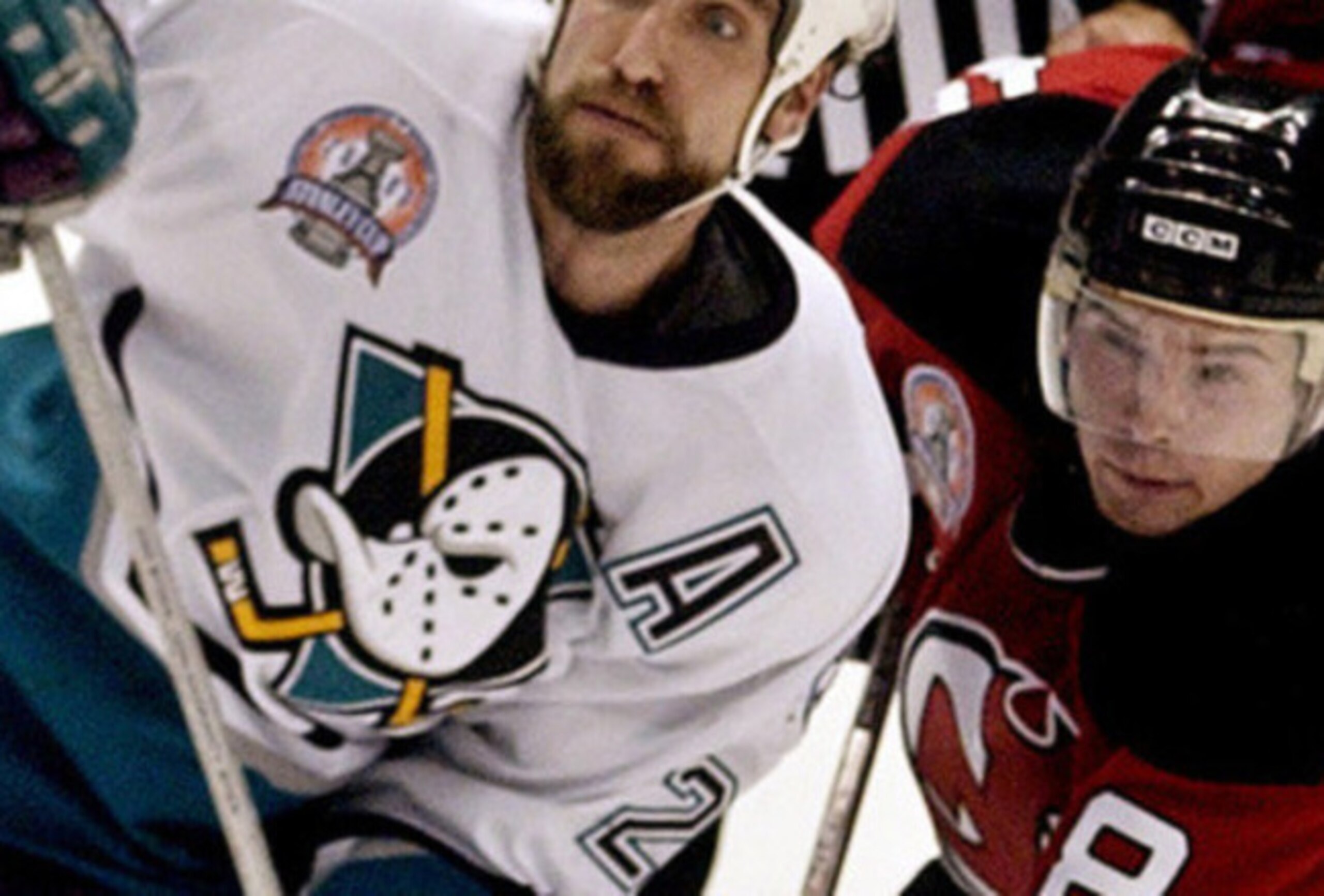 Sergei Brylin fights for a loose puck during the 2003 Stanley Cup Final.