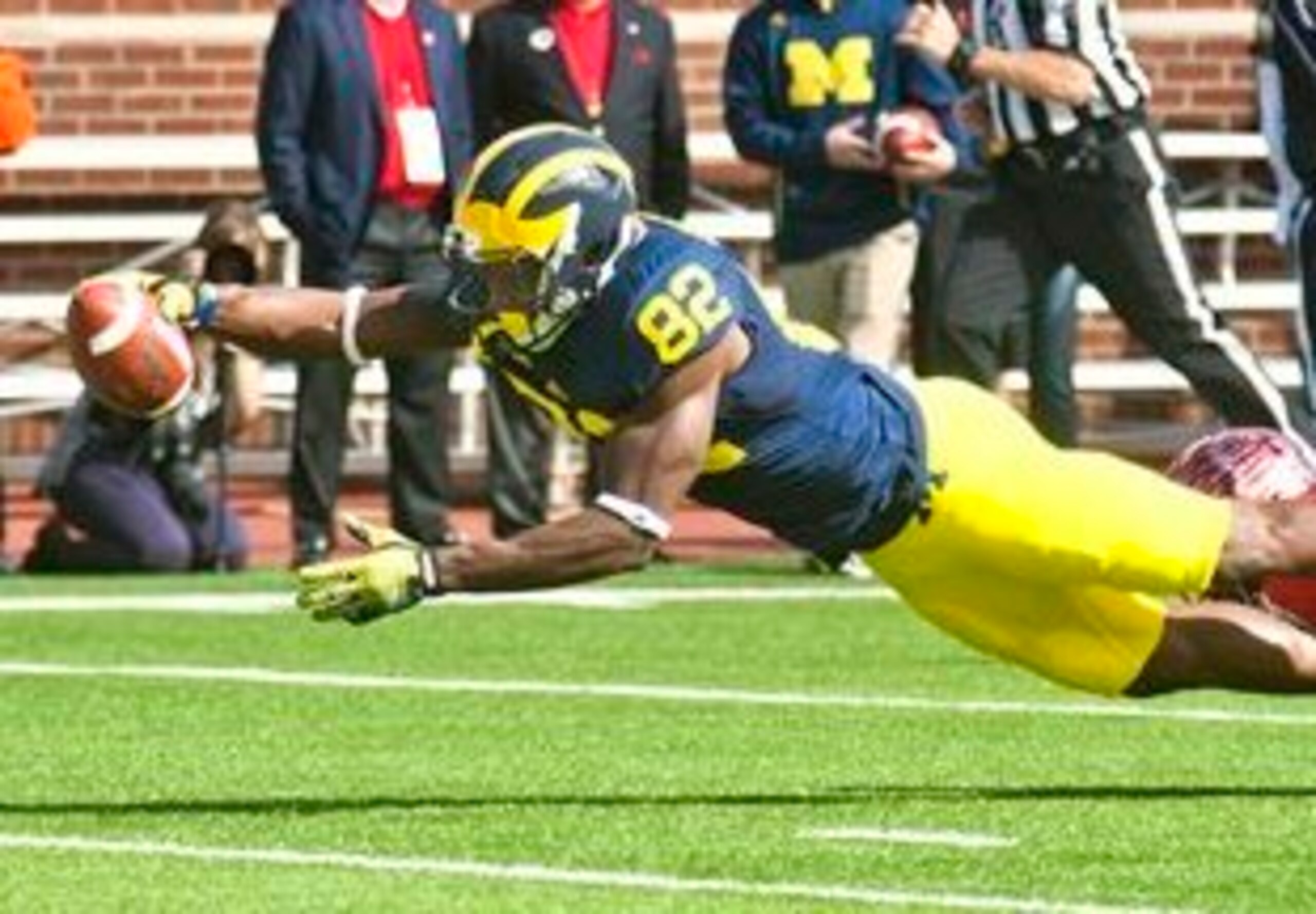 Michigan wide receiver Amara Darboh (82) dives for a touchdown in the first quarter of an NCAA college football game in Ann Arbor, Mich., Saturday, Sept. 13, 2014. (AP Photo/Tony Ding)
