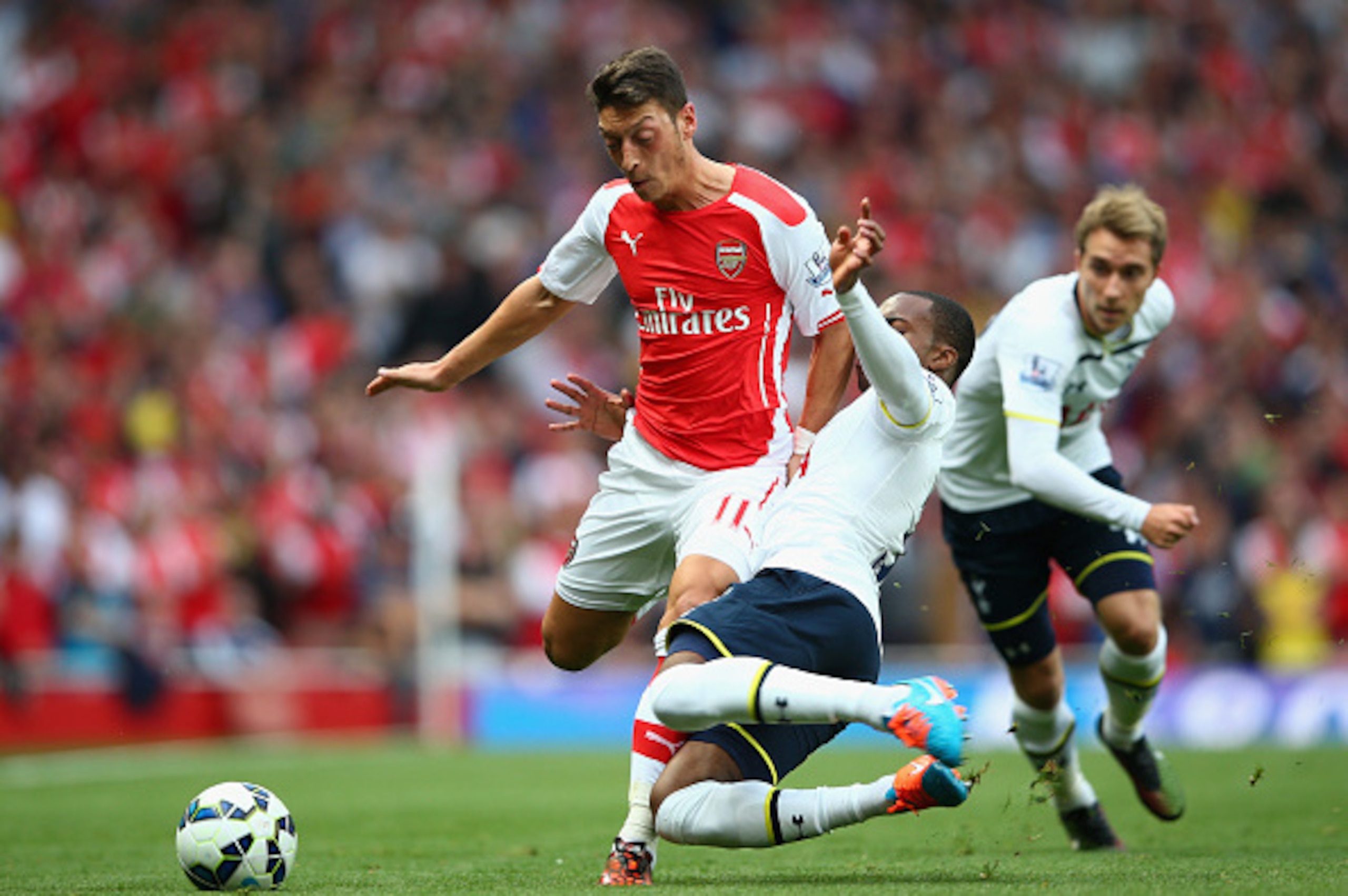 Mesut Ozil and Danny Rose battle for the ball earlier this season Mesut Ozil and Danny Rose battle for the ball earlier this season