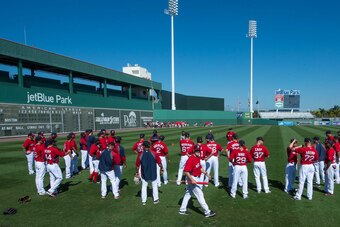 The Red Sox gather on the field at JetBlue Park during spring training in 2014.