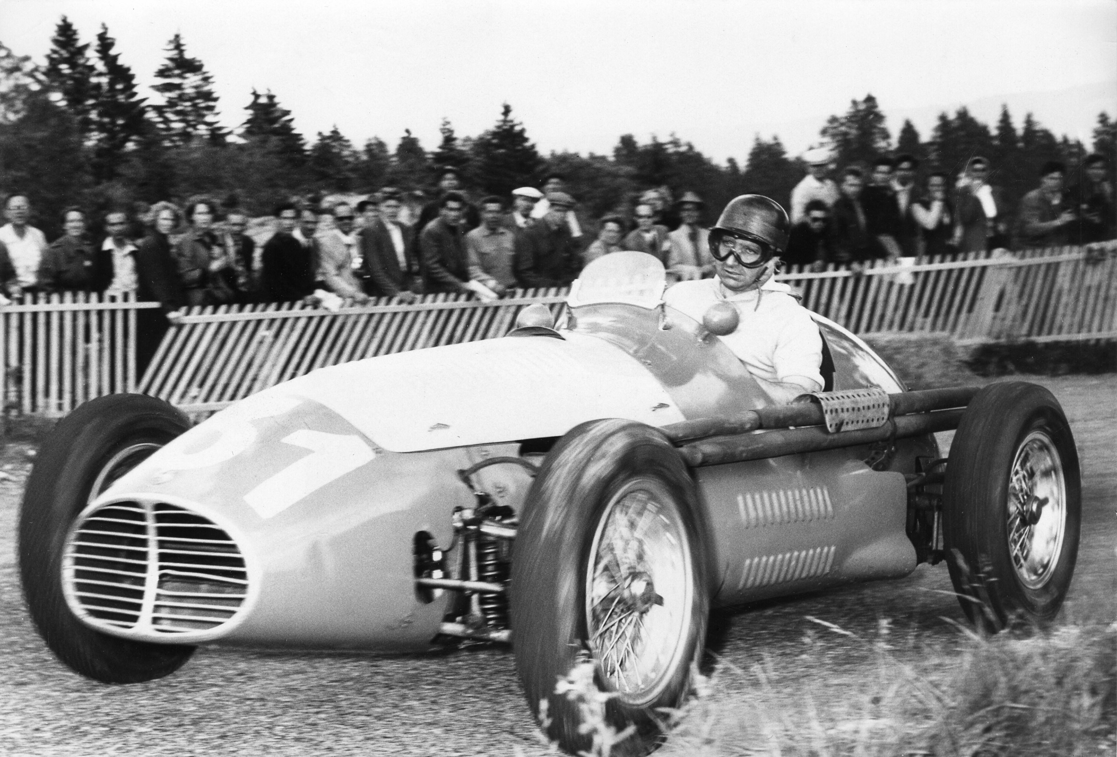 Juan Manuel Fangio at the 1956 British Grand Prix. Juan Manuel Fangio at the 1956 British Grand Prix.