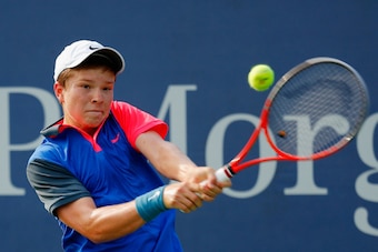 Stefan Kozlov hits a backhand during the 2014 U.S. Open qualifying round.