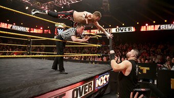 Sami Zayn shows off his aerial style early on in his match with Kevin Owens