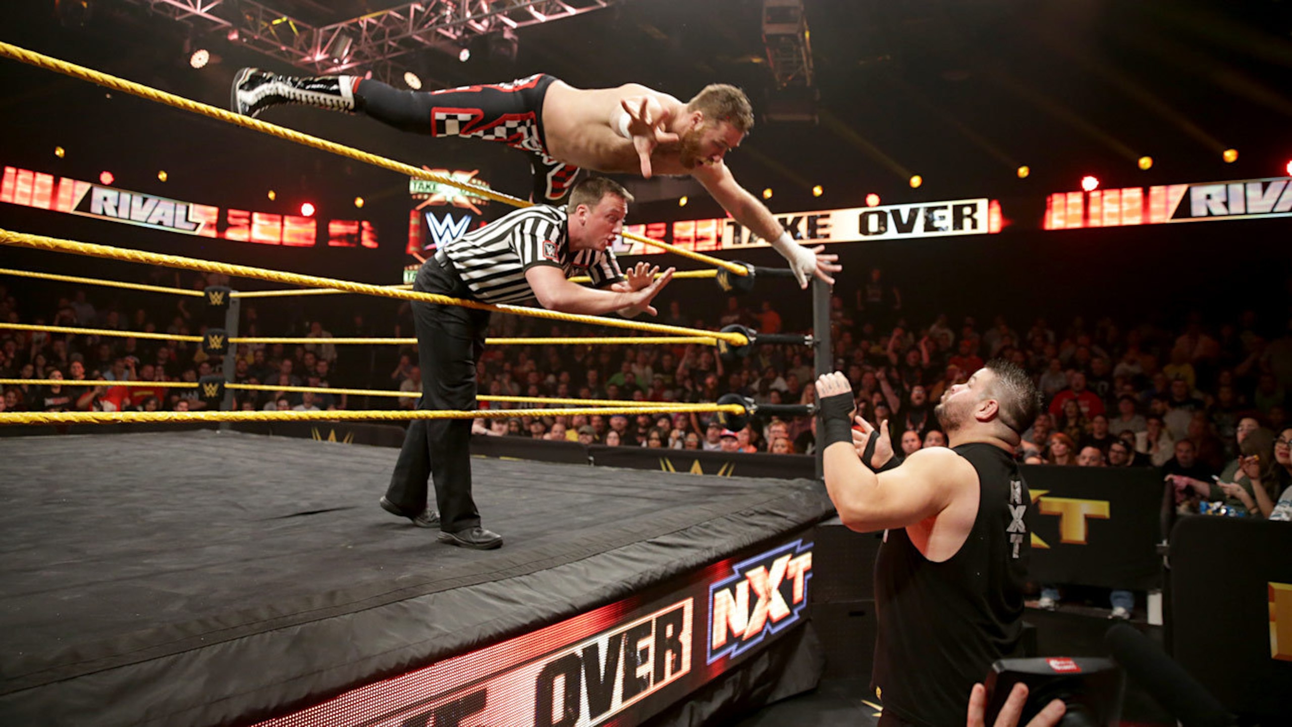 Sami Zayn shows off his aerial style early on in his match with Kevin Owens