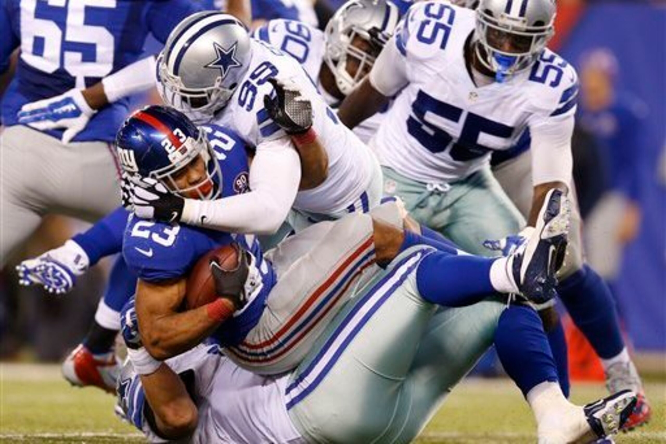 Cowboys DE George Selvie makes a tackle on Rashad Jennings. Might he end up a Giant?