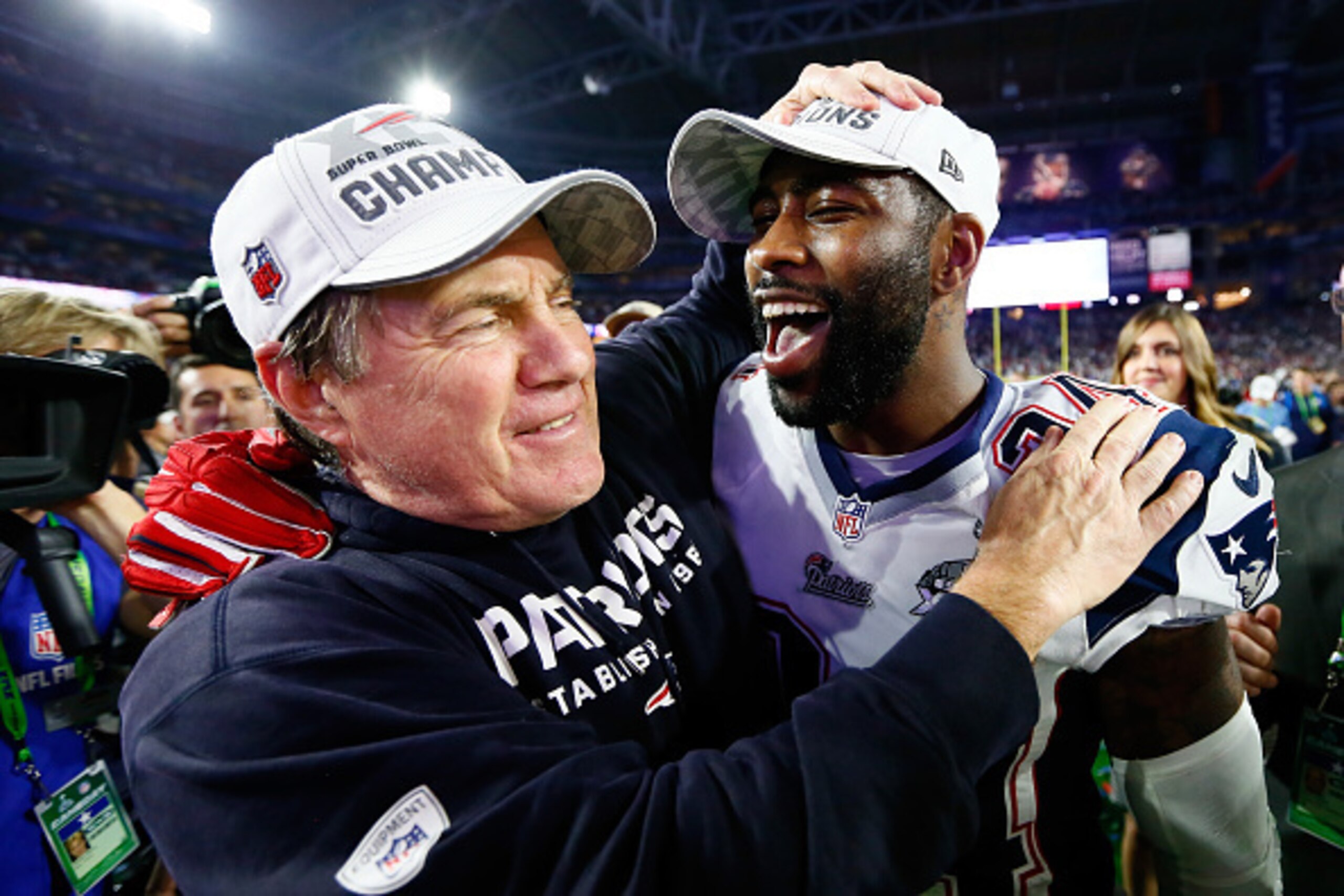 Bill Belichick (l) wants to hold on to Darrelle Revis for a long time.