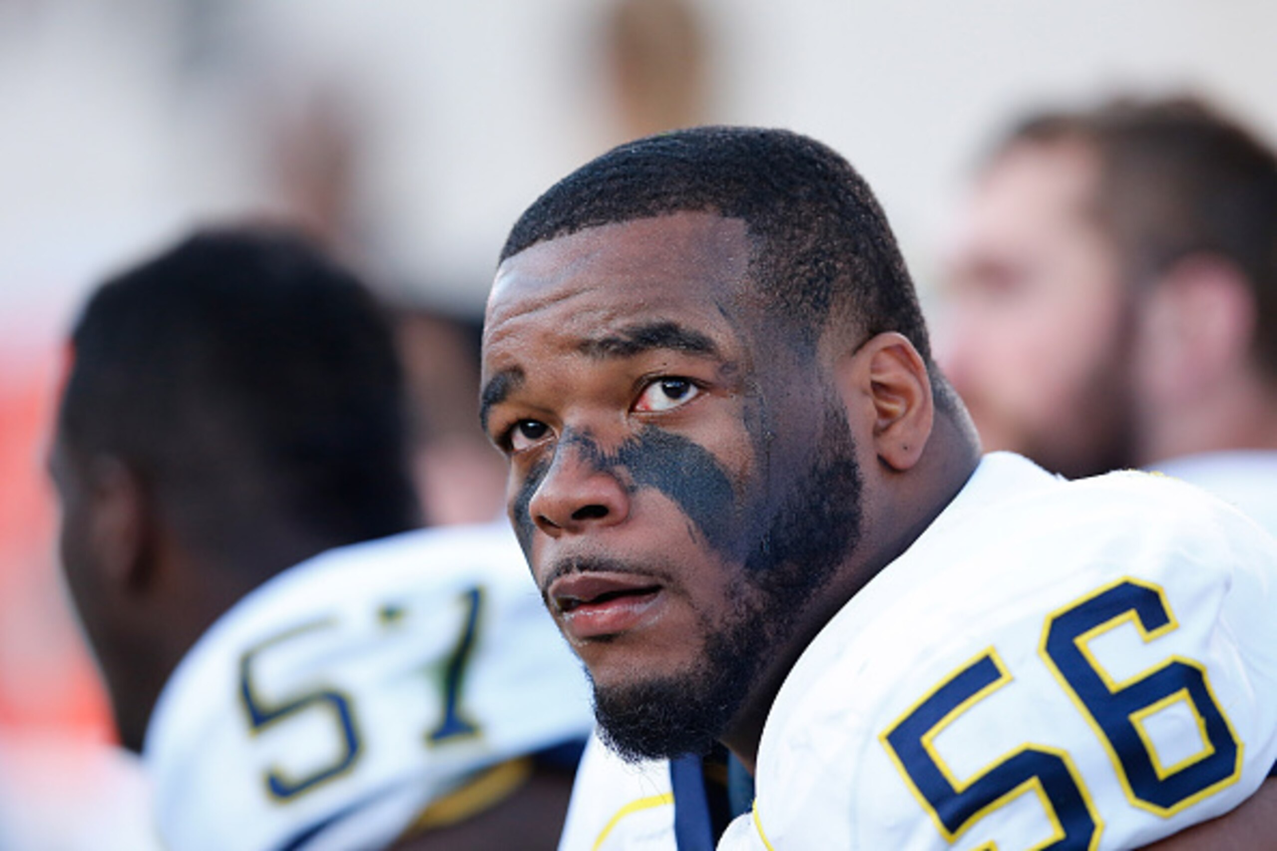 EAST LANSING, MI - OCTOBER 25: Ondre Pipkins #56 of the Michigan Wolverines watches the action from the sidelines during the fourth quarter of the game at Spartan Stadium on October 25 , 2014 in East Lansing, Michigan. The Spartans defeated the Wolverines