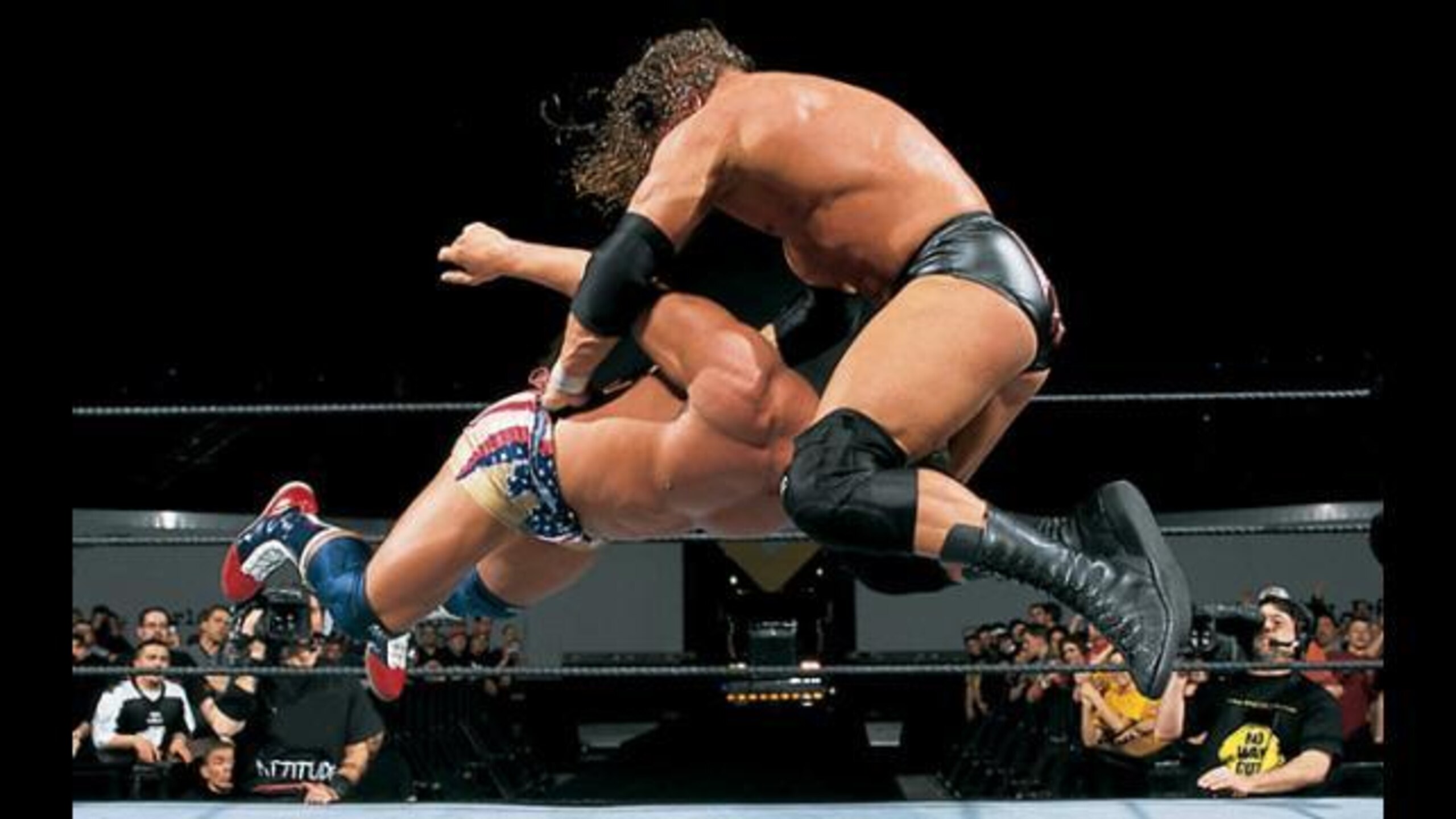 Triple H hits Kurt Angle with the Pedigree.