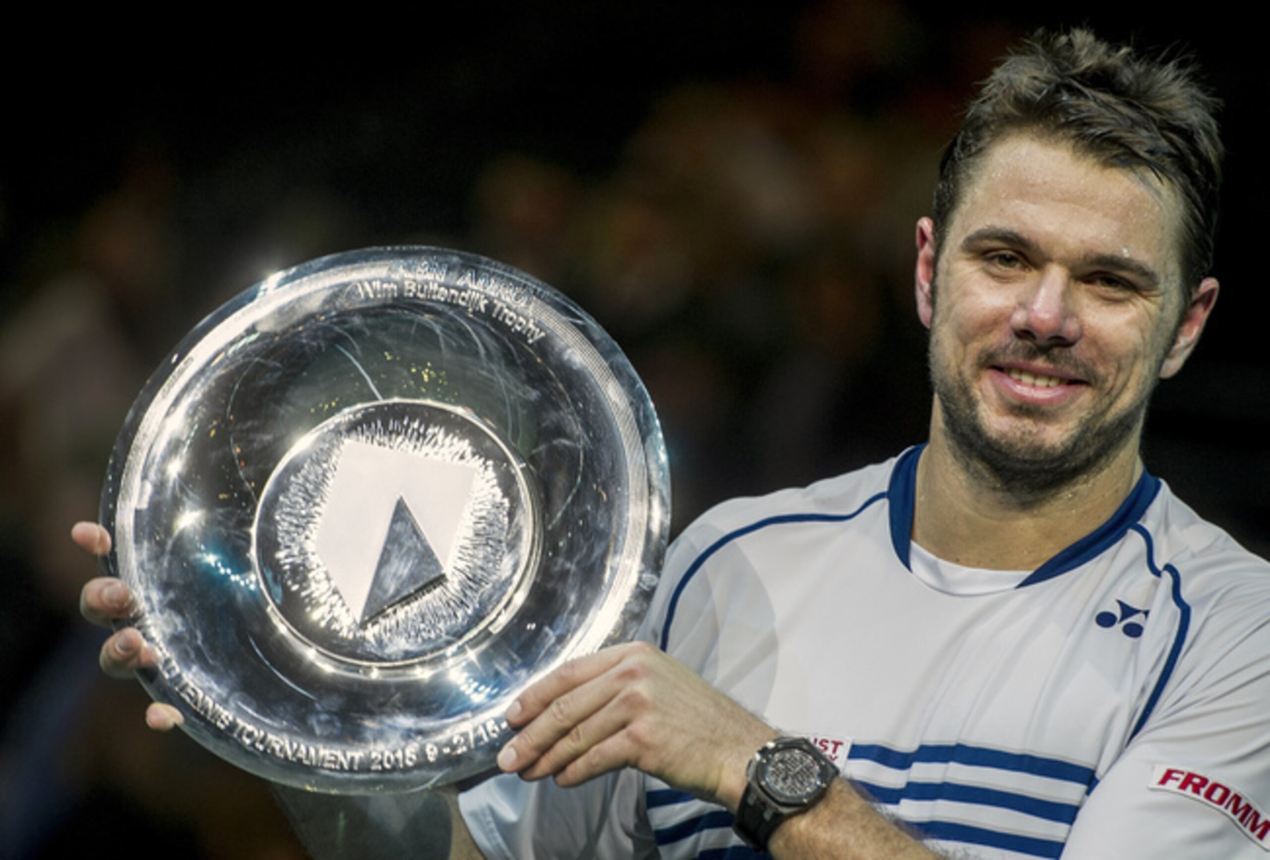 Stan Wawrinka holds trophy after winning the 2015 ABN Amro World Tennis Tournament in Rotterdam.