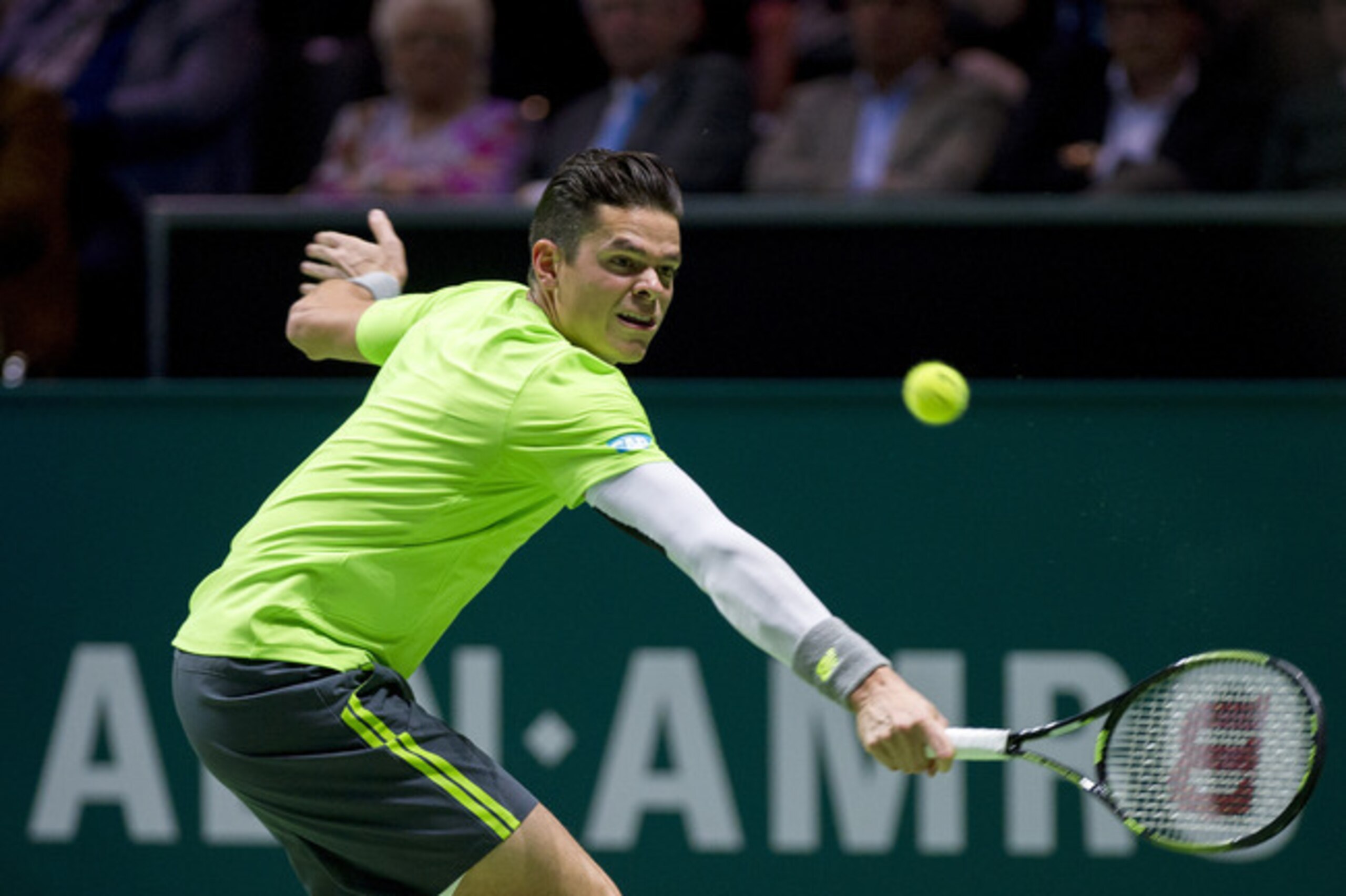 Milos Raonic hits a volley in a match during the ABN Amro World Tennis Tournament in Rotterdam.
