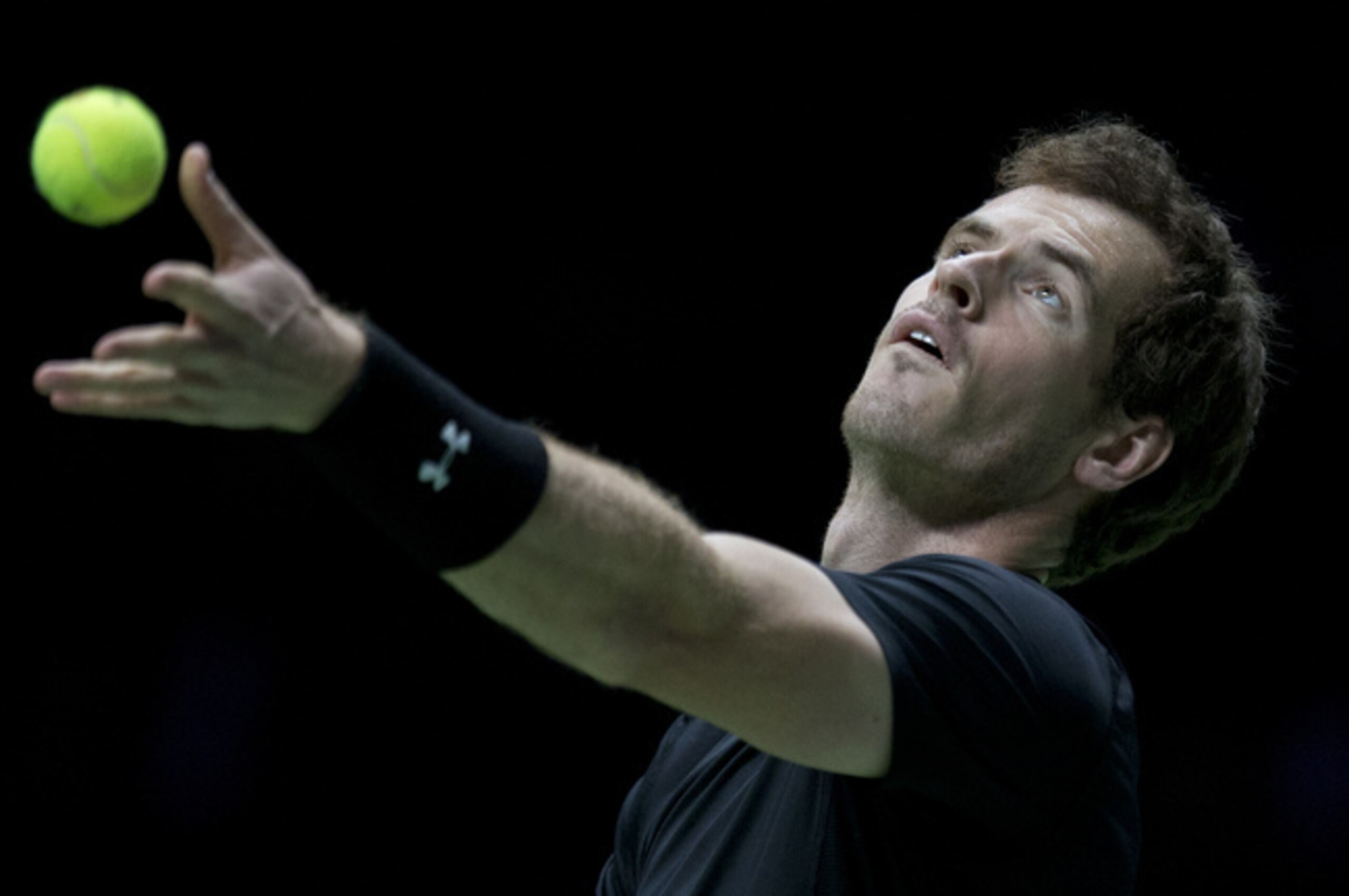 Andy Murray tosses the ball during his serve at the ABN Amro World Tennis Tournament.