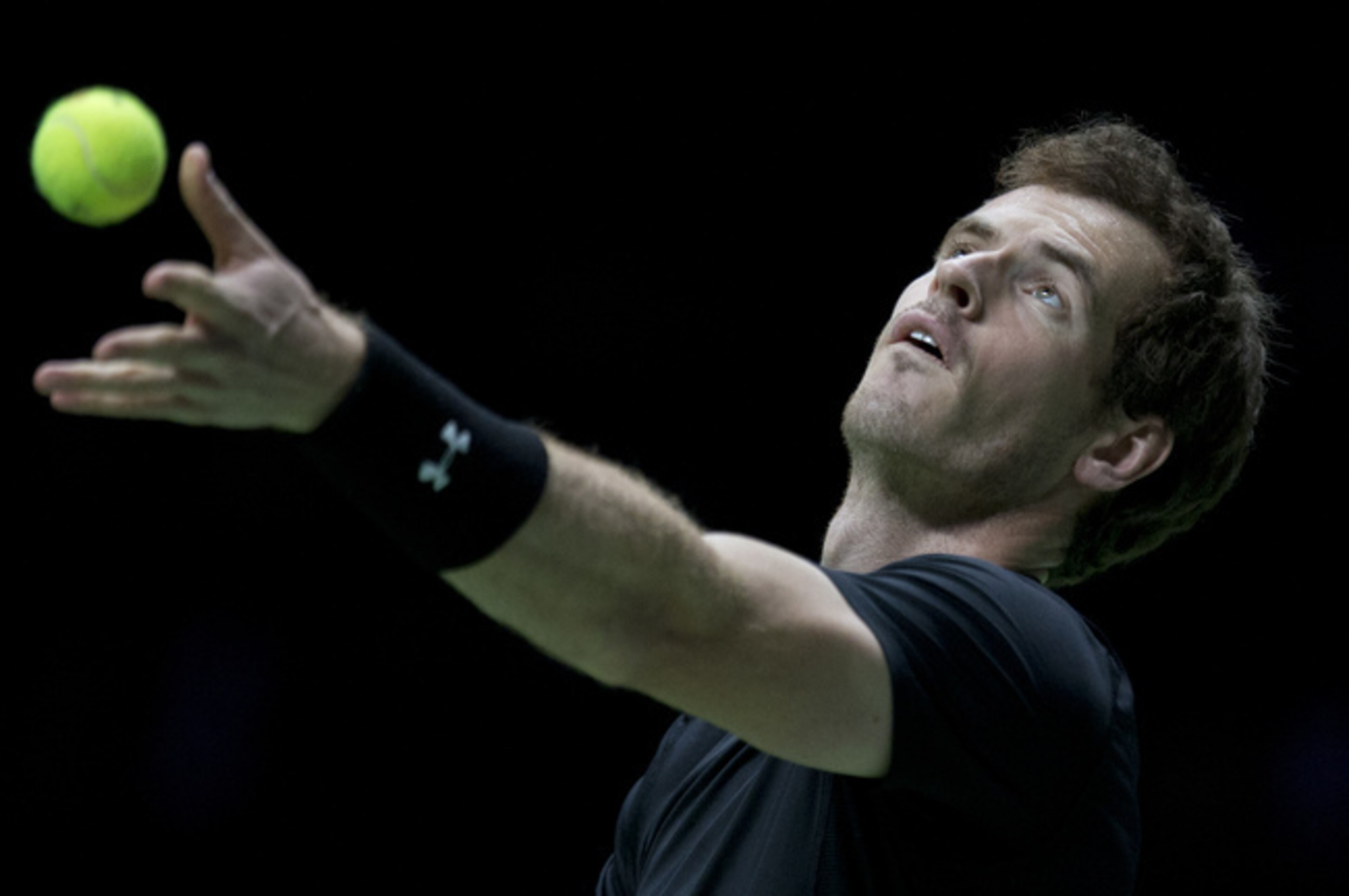 Andy Murray tosses the ball during his serve at the ABN Amro World Tennis Tournament.