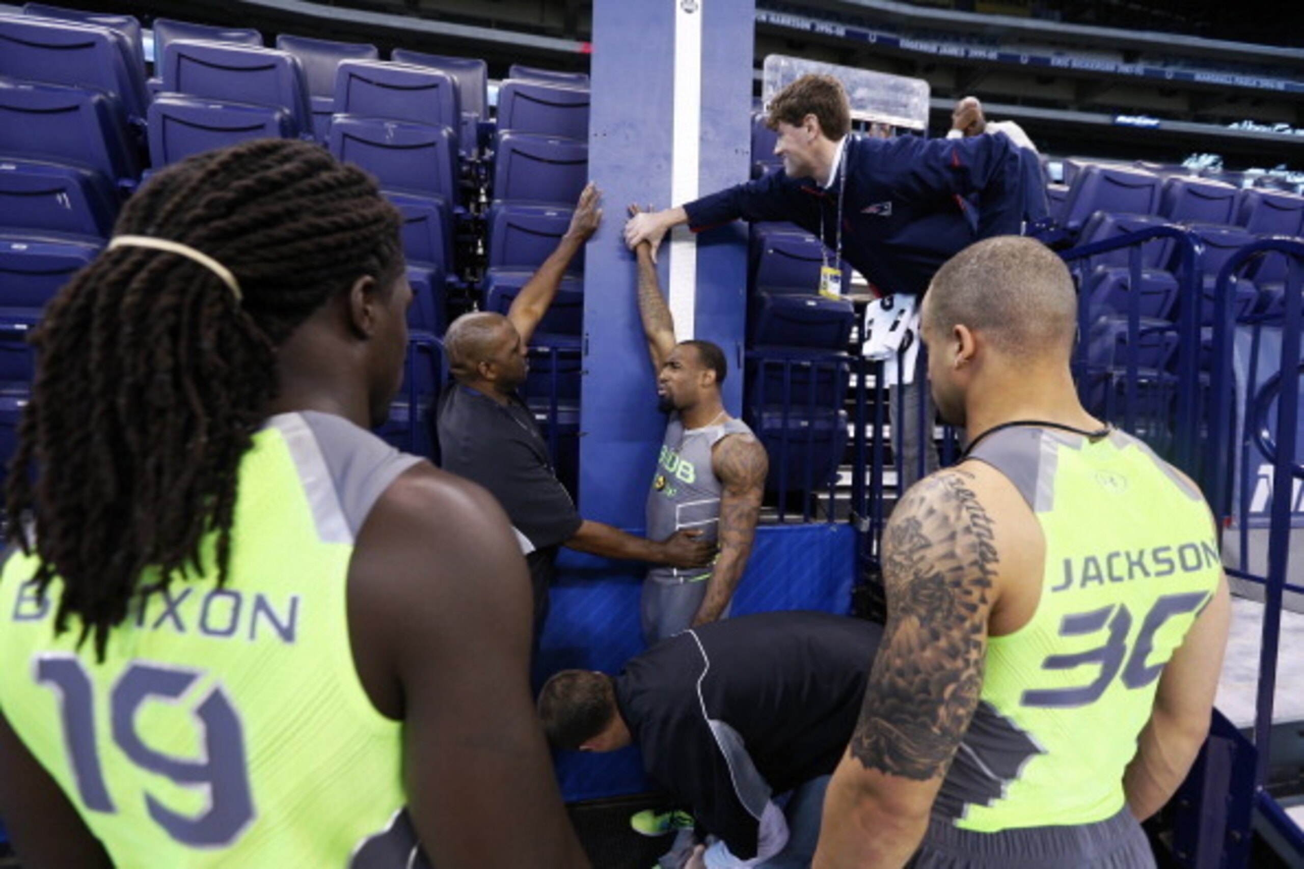 A player's reach is measured at last year's combine.