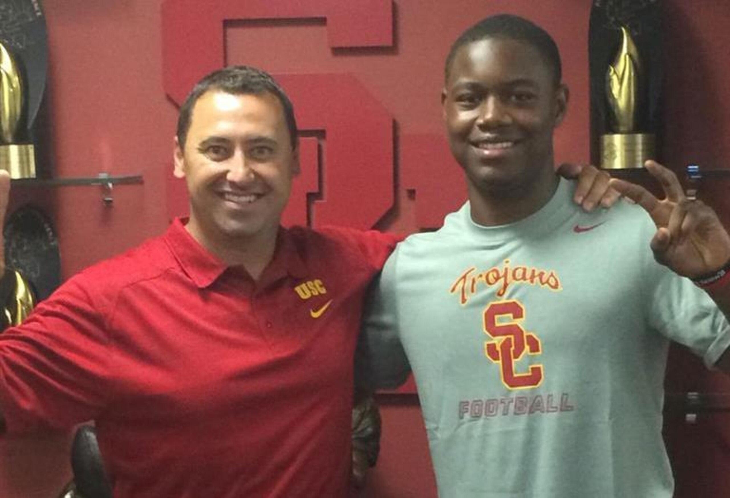Steve Sarkisian and Michigan LB Daelin Hayes