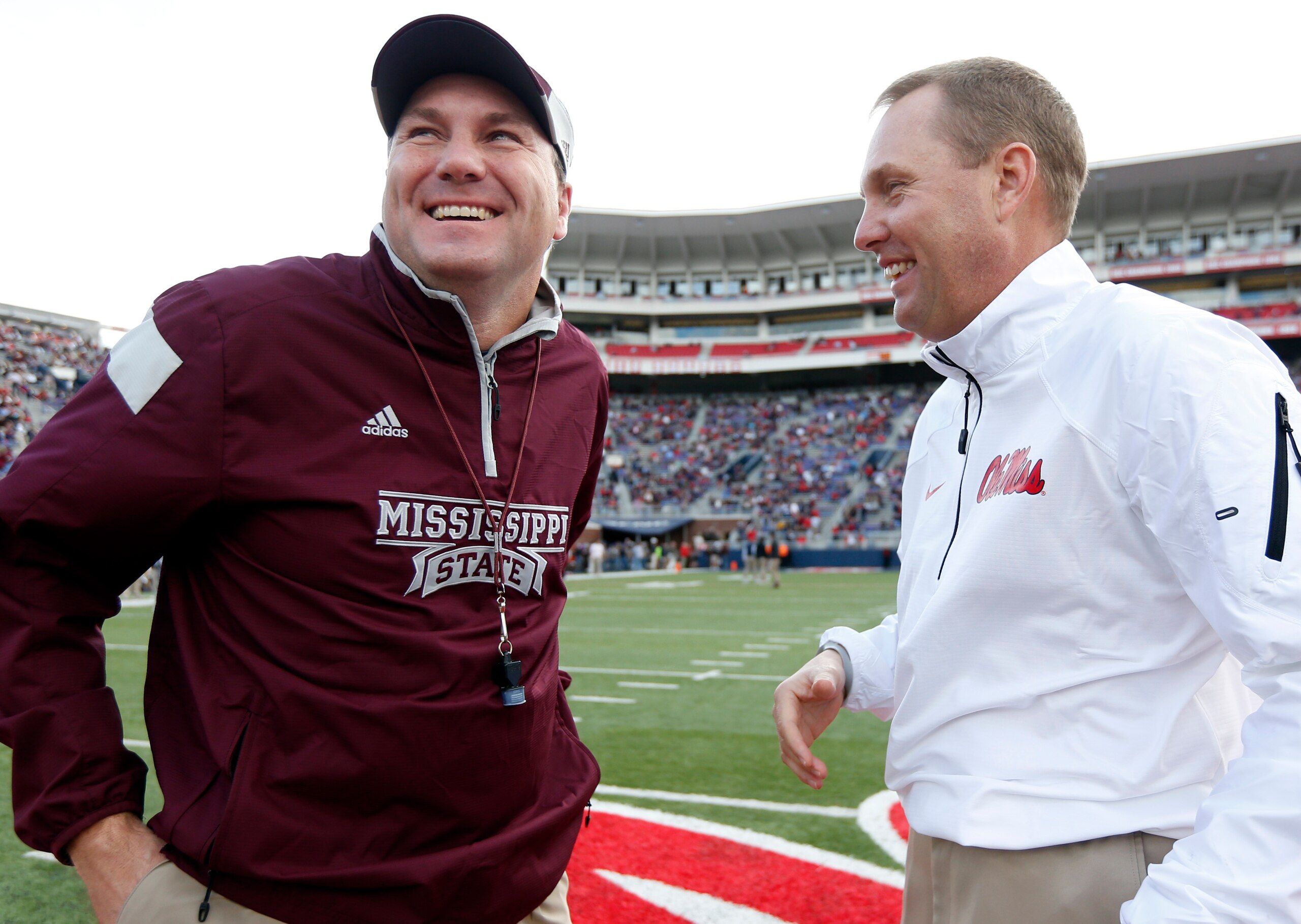 Dan Mullen, left, and Hugh Freeze look to make strides in SEC standings.