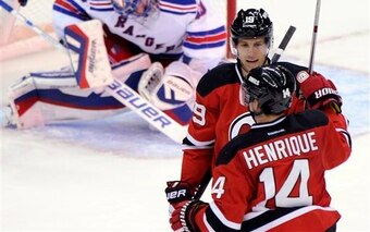 Travis Zajac and Adam Henrique celebrate a goal against the New York Rangers. Will they be the team's top two centers going forward?
