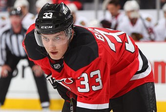 NEWARK, NJ - DECEMBER 09: Reid Boucher #33 of the New Jersey Devils looks on against the Chicago Blackhawks during the game at the Prudential Center on December 9, 2014 in Newark, New Jersey. (Photo by Andy Marlin/NHLI via Getty Images)
