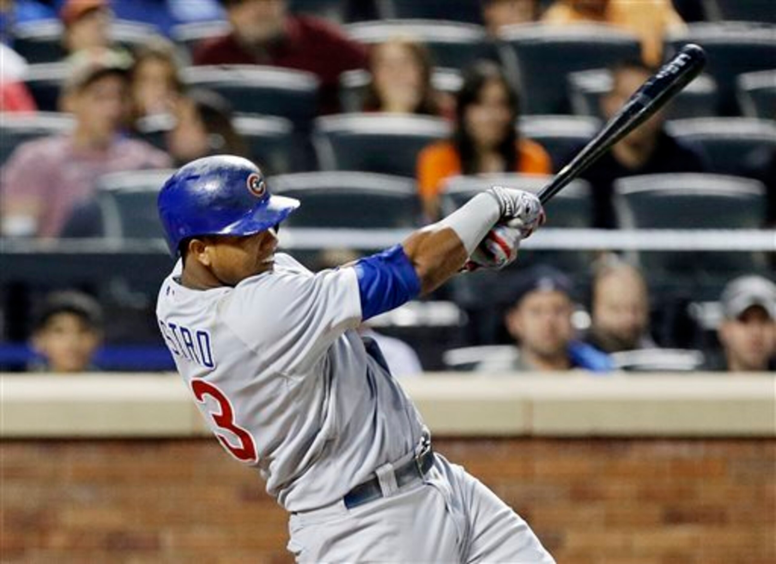Chicago Cubs' Starlin Castro follows through on an hits an RBI single during the third inning of a baseball game against the New York Mets, Friday, Aug. 15, 2014, in New York. (AP Photo/Frank Franklin II)