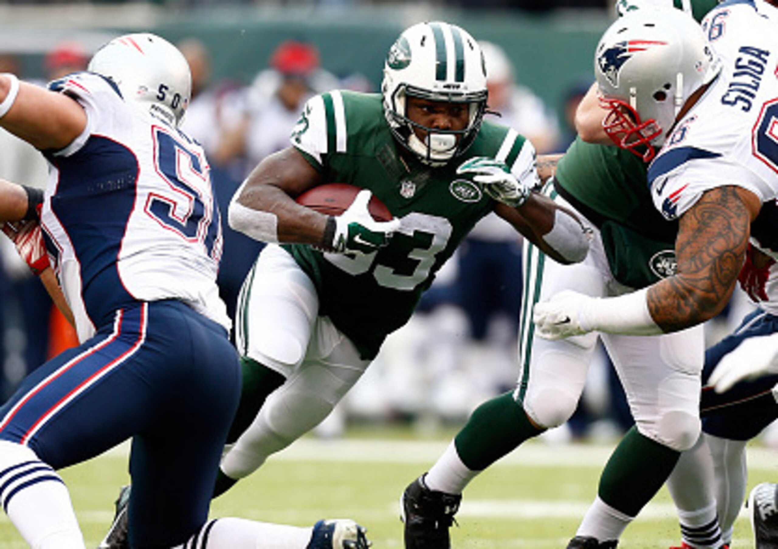 EAST RUTHERFORD, NJ - DECEMBER 21:  Running back Chris Ivory #33 of the New York Jets carries the ball against the New England Patriots during a game at MetLife Stadium on December 21, 2014 in East Rutherford, New Jersey.  (Photo by Jeff Zelevansky/Getty 