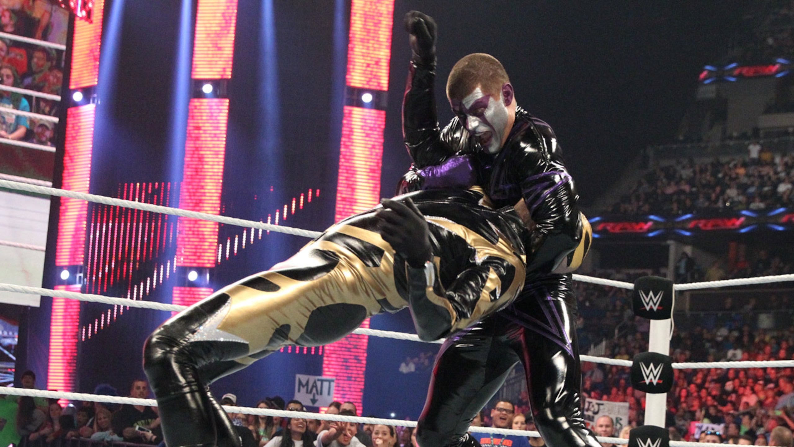Stardust attacks Goldust.